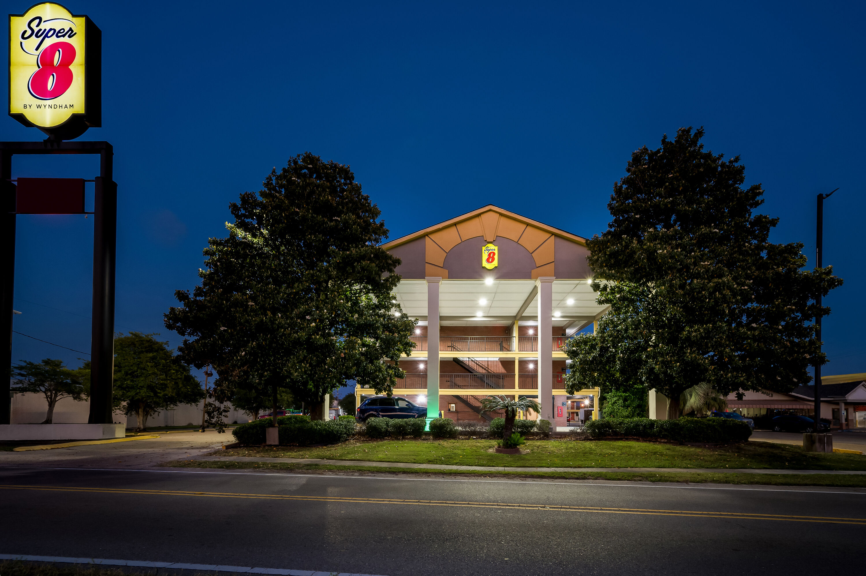 Exterior Night Image of Super 8 by Wyndham Metairie hotel in Metairie, Louisiana