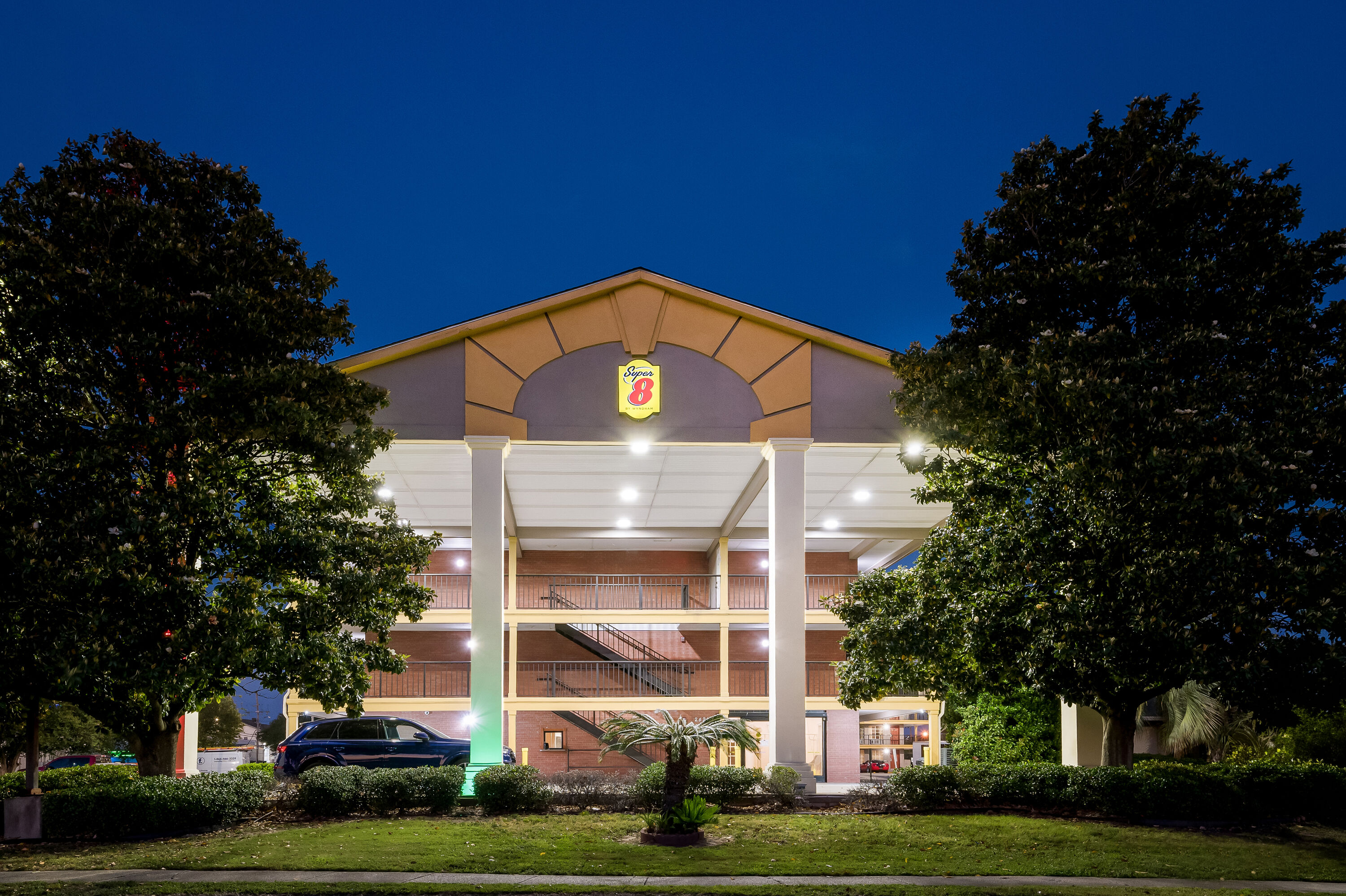 Exterior Night Image of Super 8 by Wyndham Metairie hotel in Metairie, Louisiana