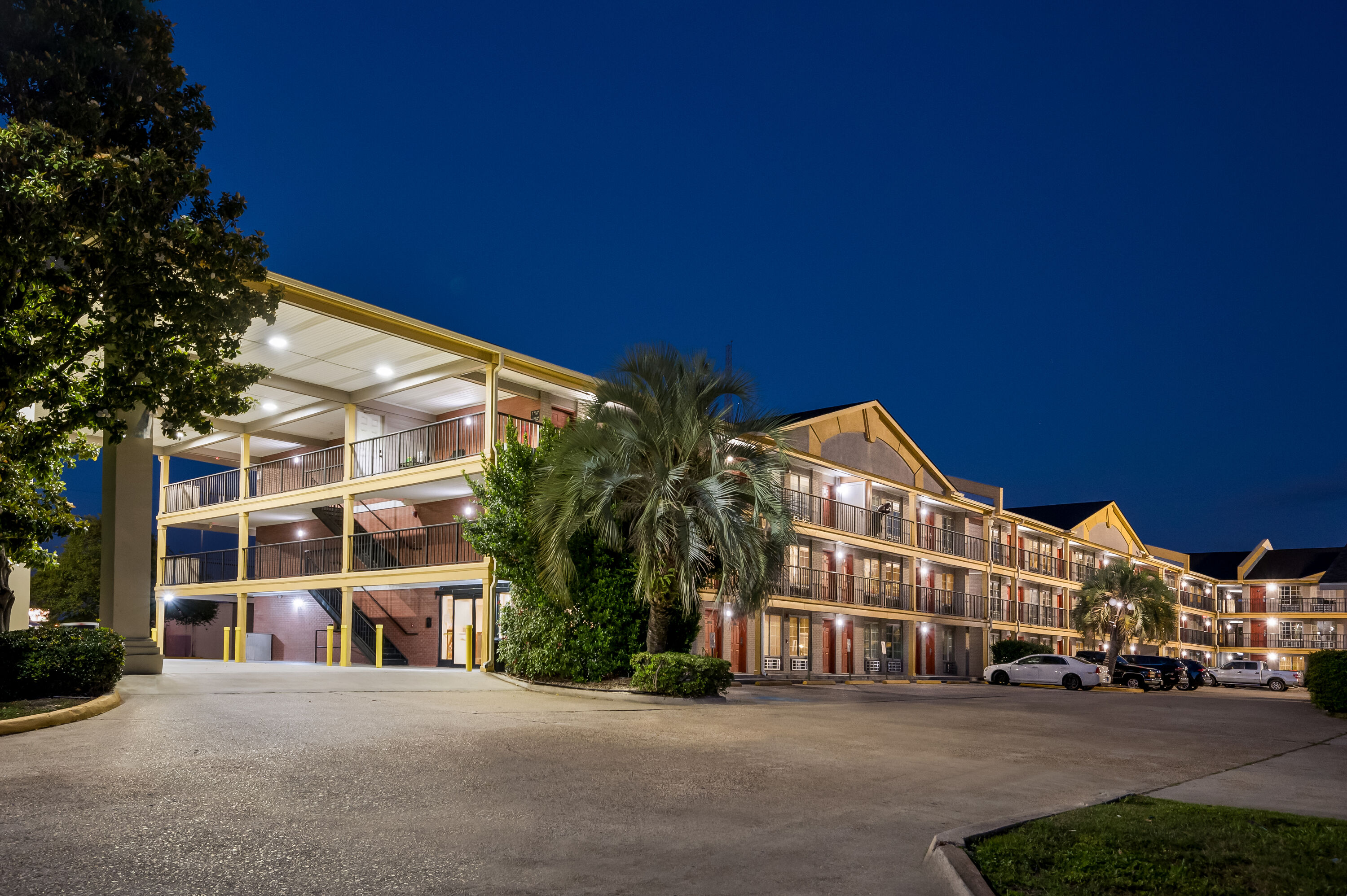 Exterior Night Image of Super 8 by Wyndham Metairie hotel in Metairie, Louisiana