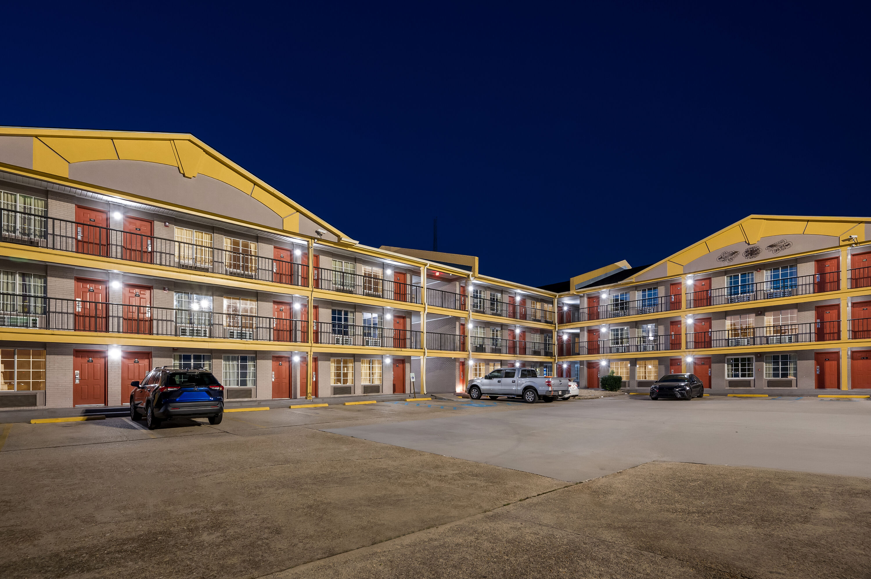 Exterior Night Image of Super 8 by Wyndham Metairie hotel in Metairie, Louisiana
