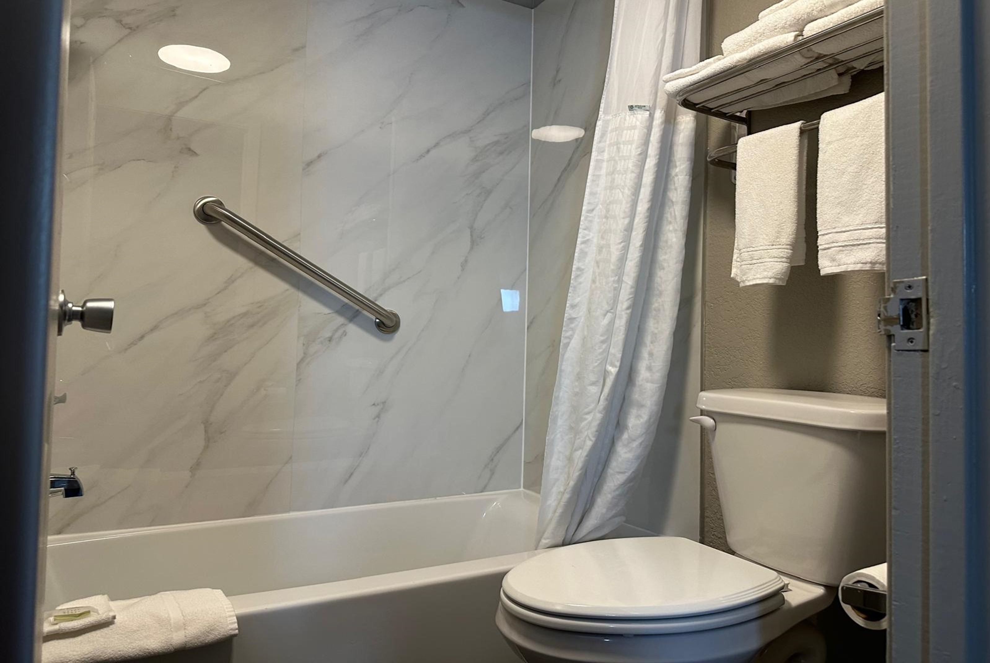 Guest room bath at the Super 8 by Wyndham Monroe in Monroe, Louisiana