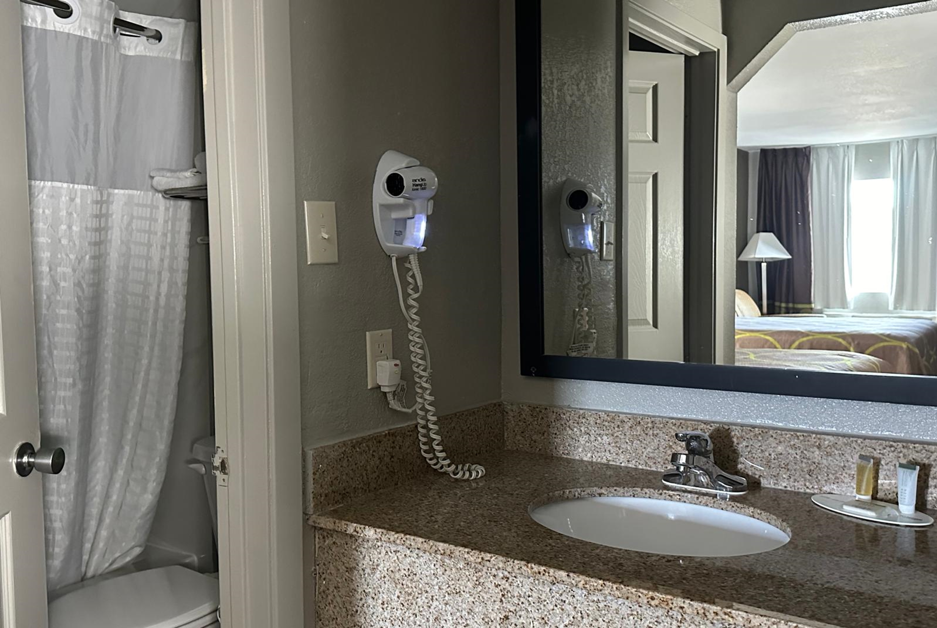 Guest room bath at the Super 8 by Wyndham Monroe in Monroe, Louisiana