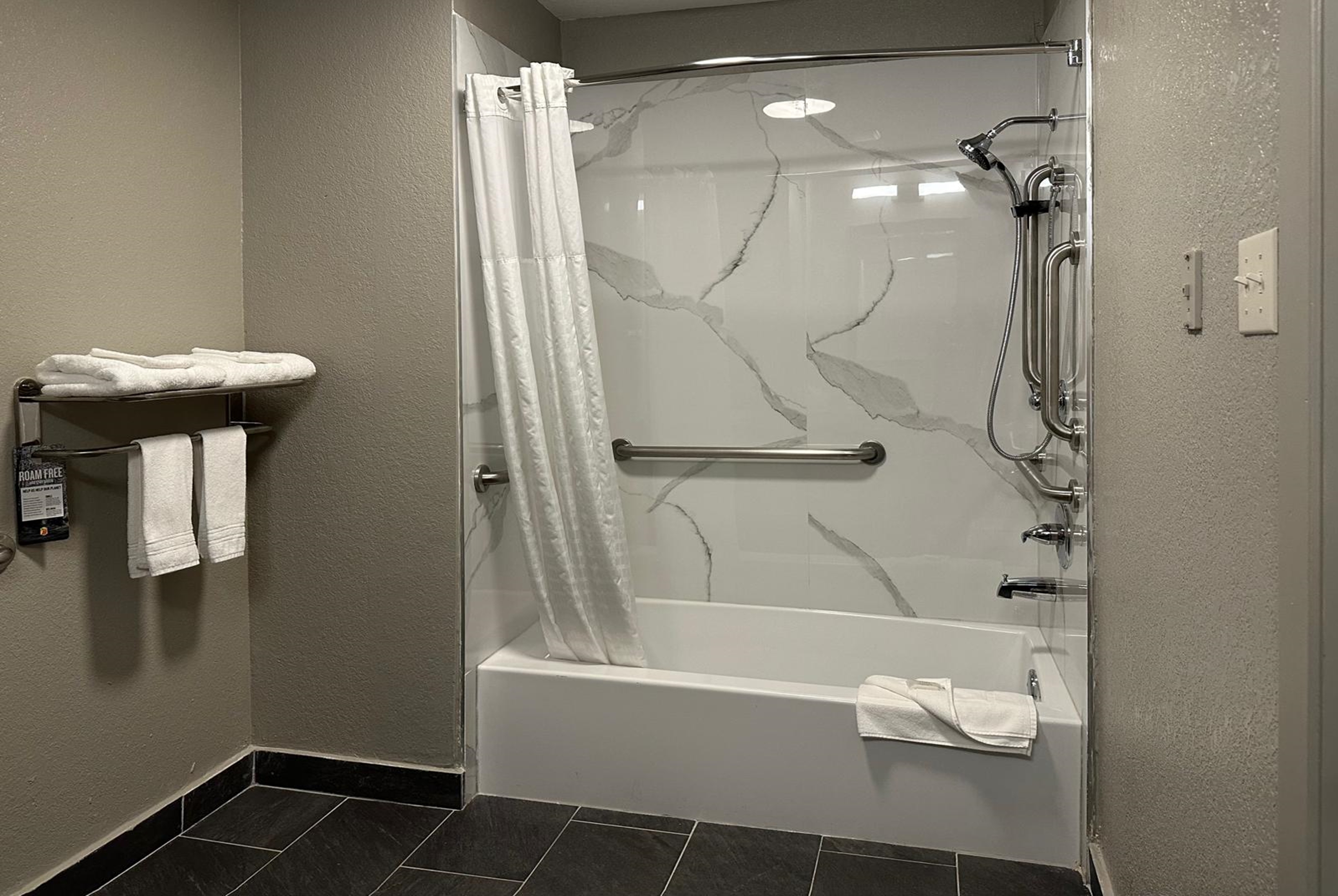 Guest room bath at the Super 8 by Wyndham Monroe in Monroe, Louisiana