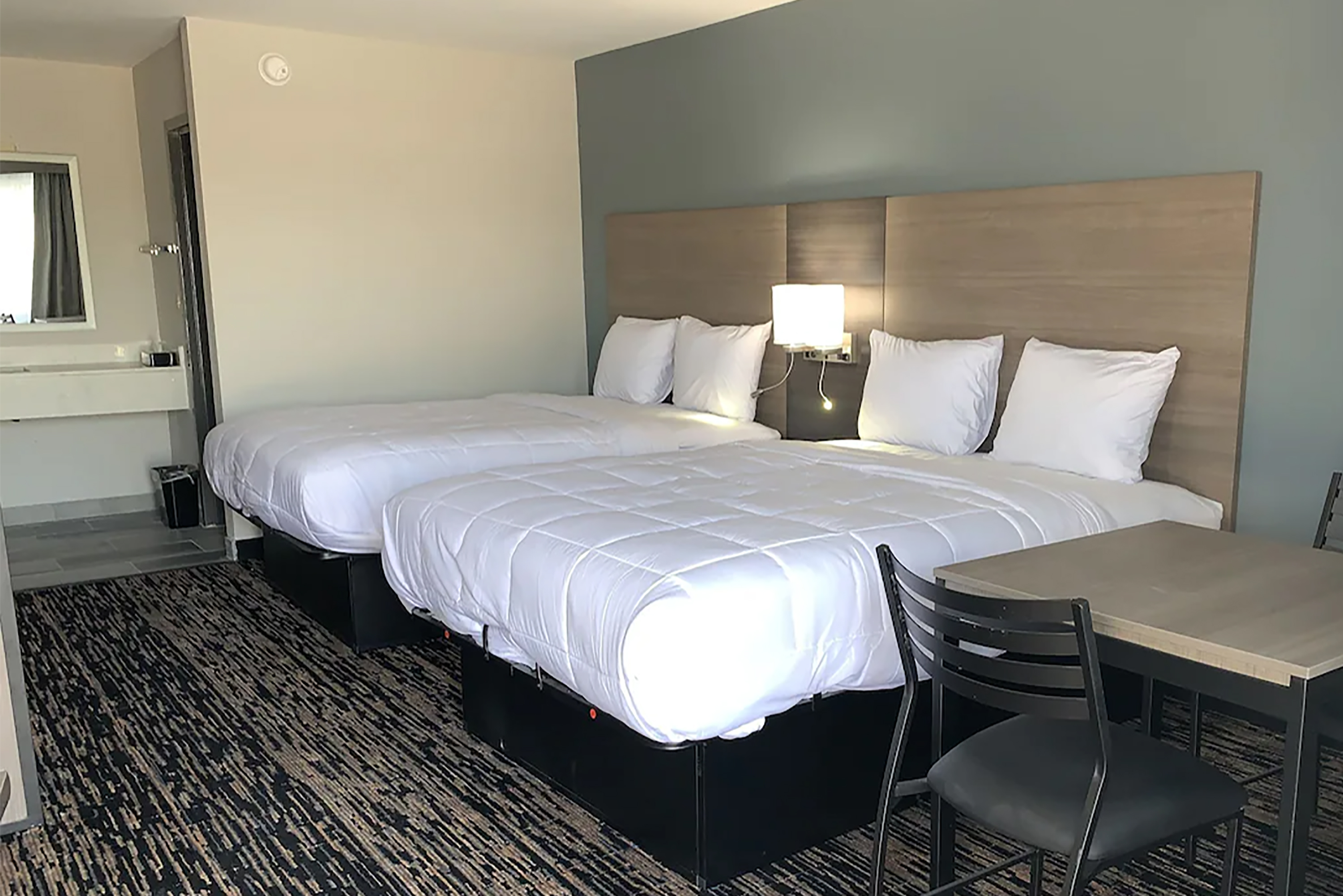 Guest room at the Super 8 by Wyndham Sulphur South in Sulphur, Louisiana