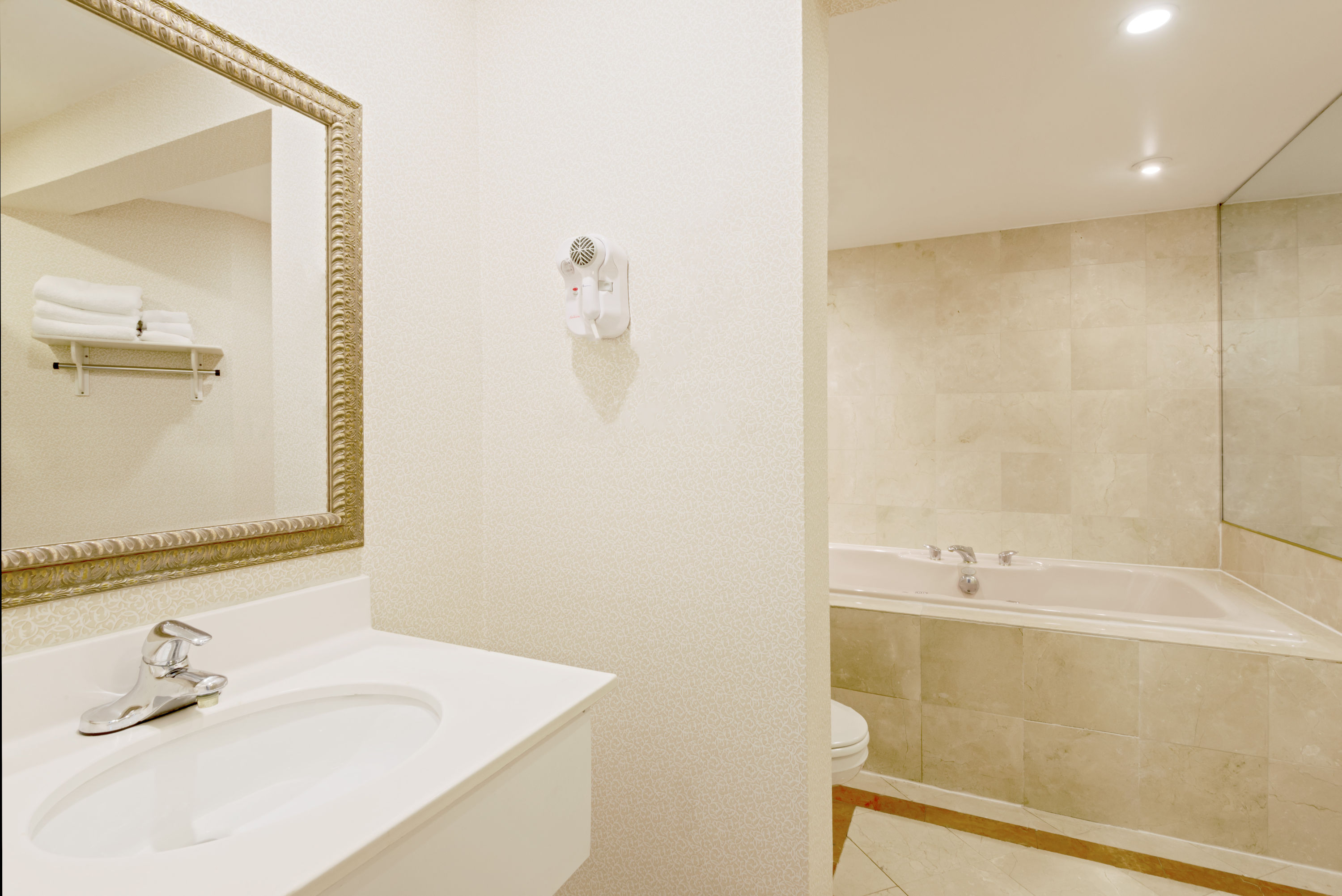 Guest room bath at the Super 8 by Wyndham Sturbridge in Sturbridge, Massachusetts