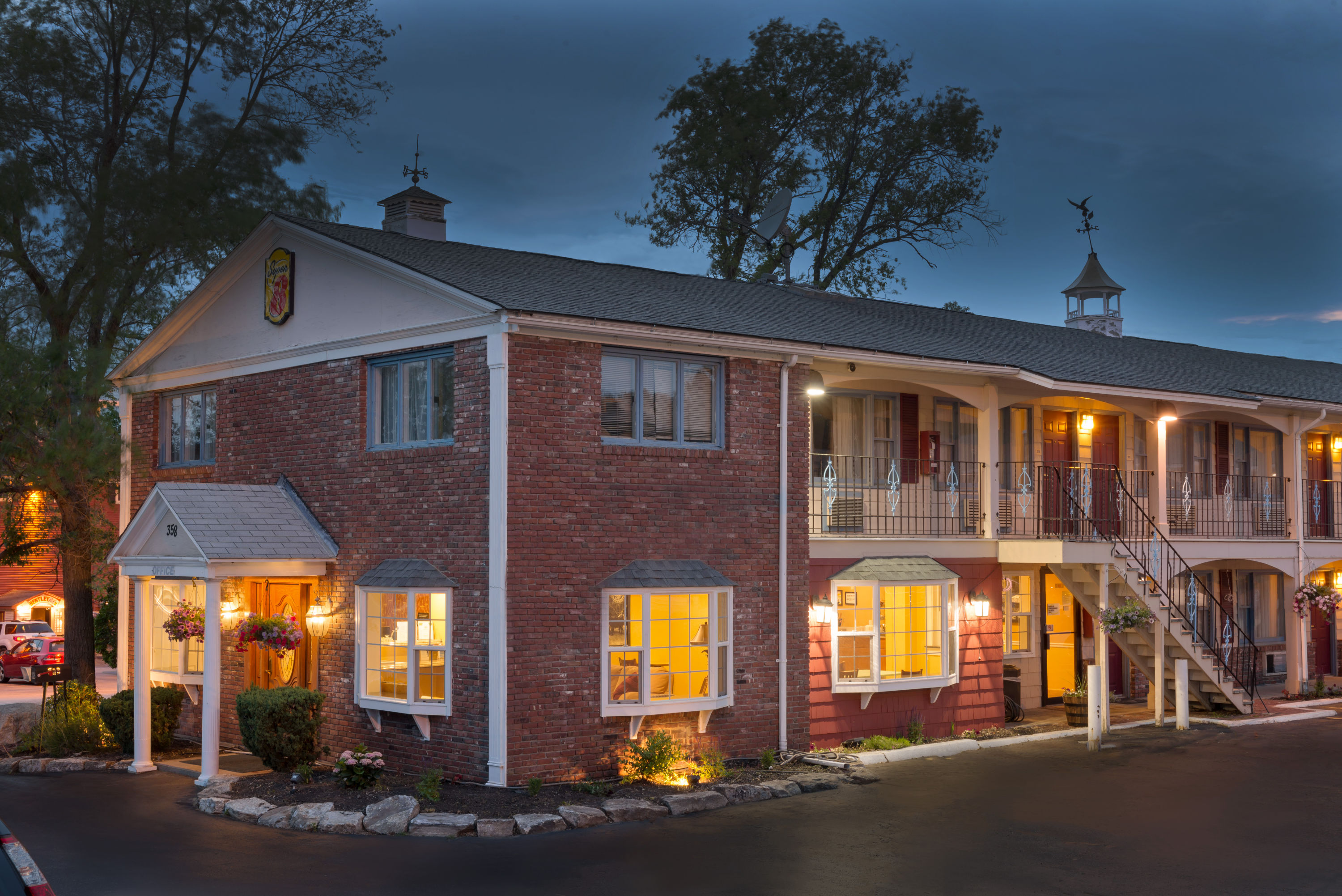 Exterior Dusk Image of Super 8 by Wyndham Sturbridge hotel in Sturbridge, Massachusetts