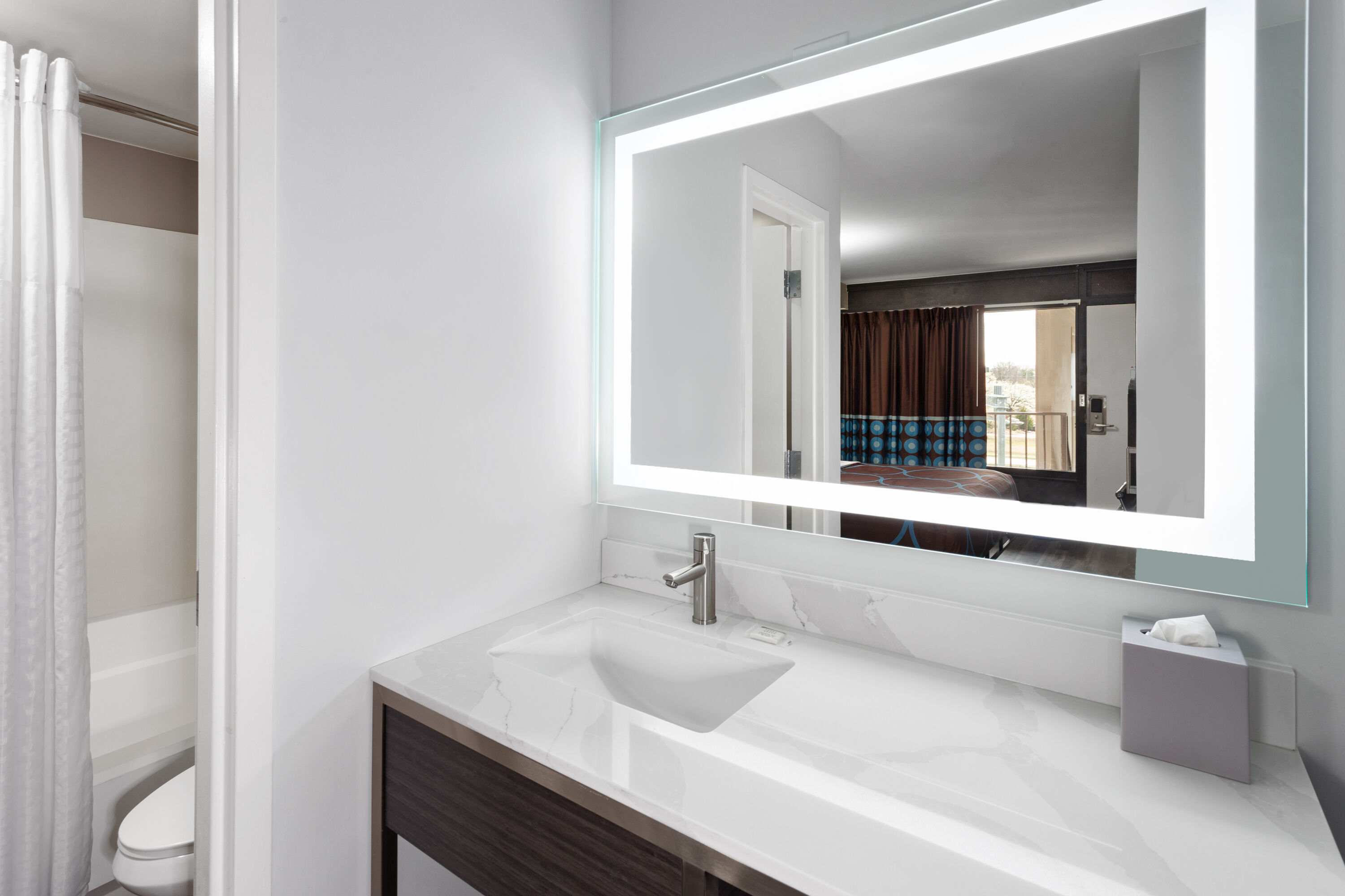 Guest room bath at the Super 8 by Wyndham Baltimore Northwest in Baltimore, Maryland