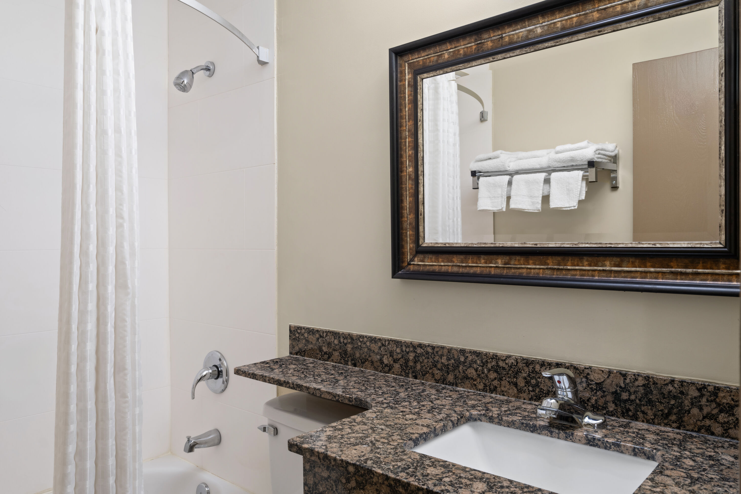 Guest room bath at the Super 8 by Wyndham Hagerstown I-70 in Hagerstown, Maryland