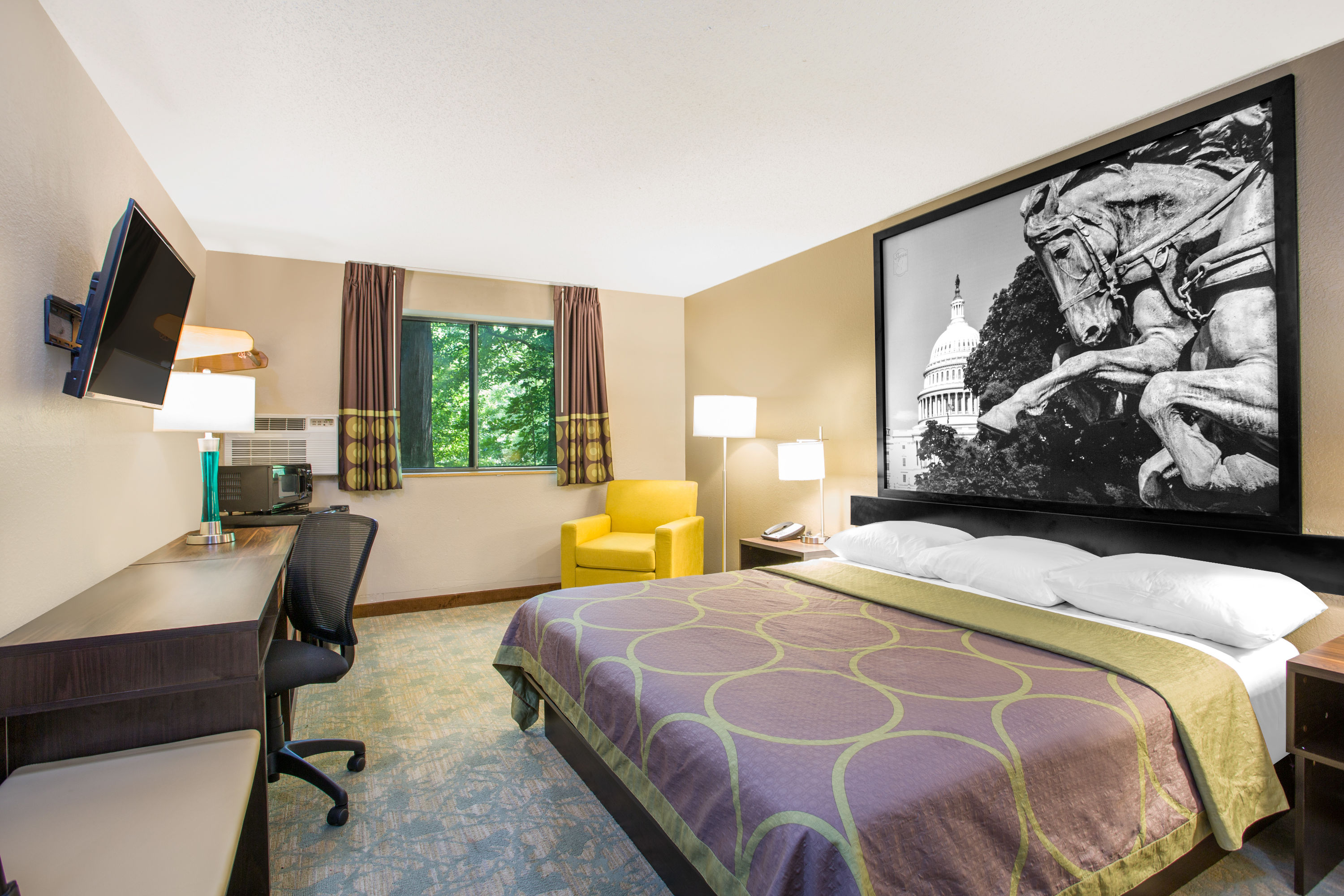 Guest room at the Super 8 by Wyndham Waldorf in Waldorf, Maryland