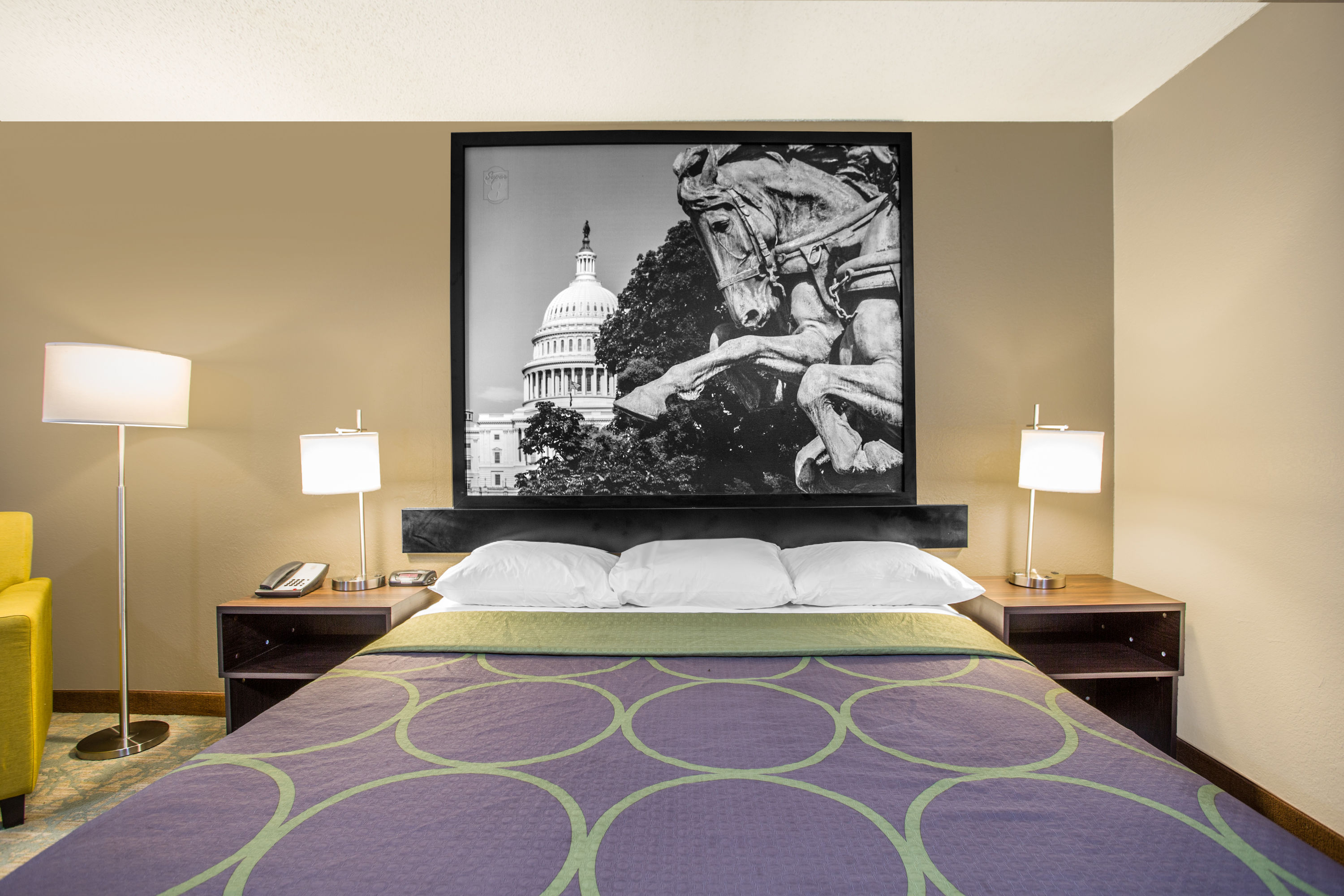 Queen bed guest room at the Super 8 by Wyndham Waldorf in Waldorf, Maryland