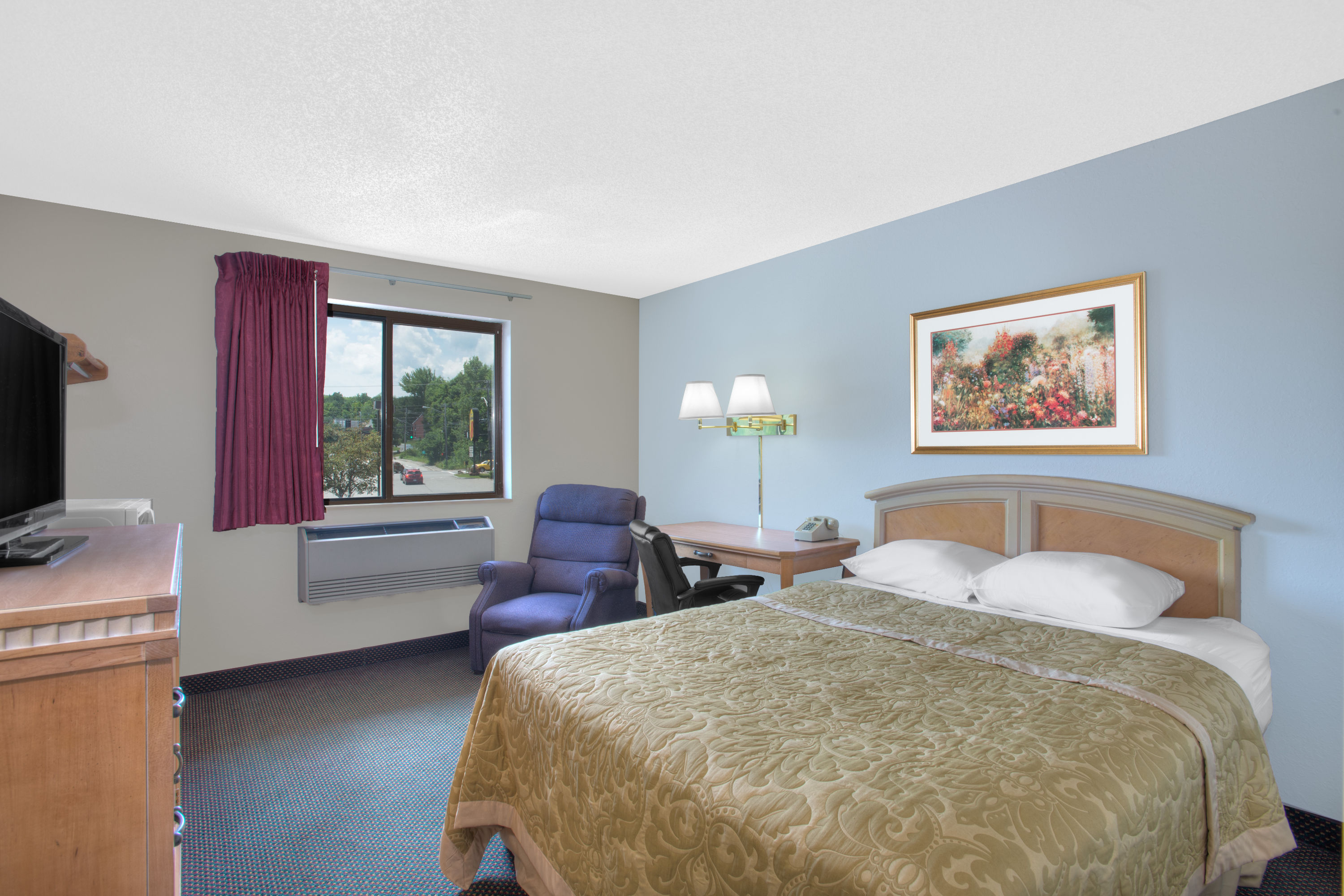 Guest room at the Super 8 by Wyndham Augusta in Augusta, Maine