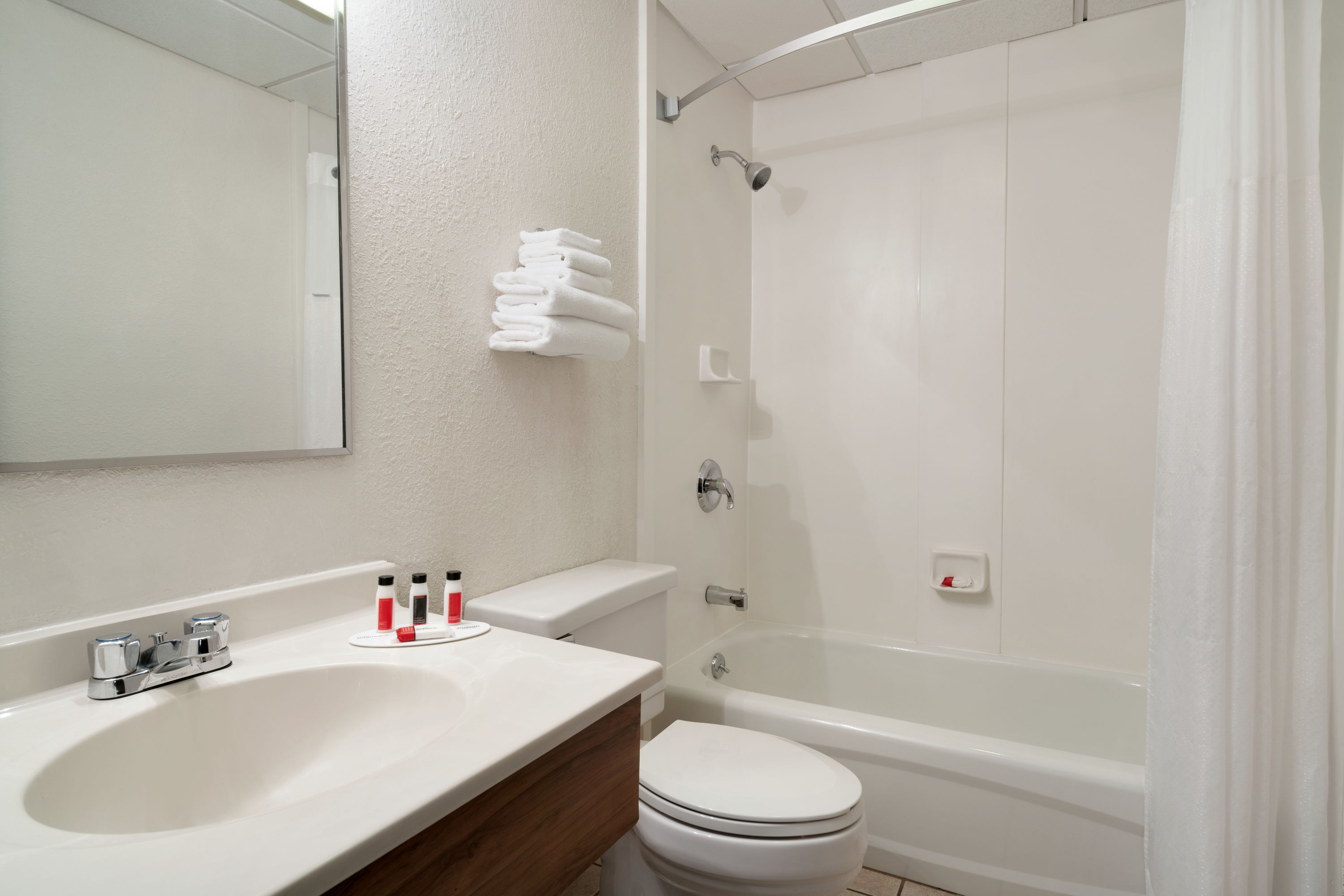 Guest room bath at the Super 8 by Wyndham Portland ME in Westbrook, Maine