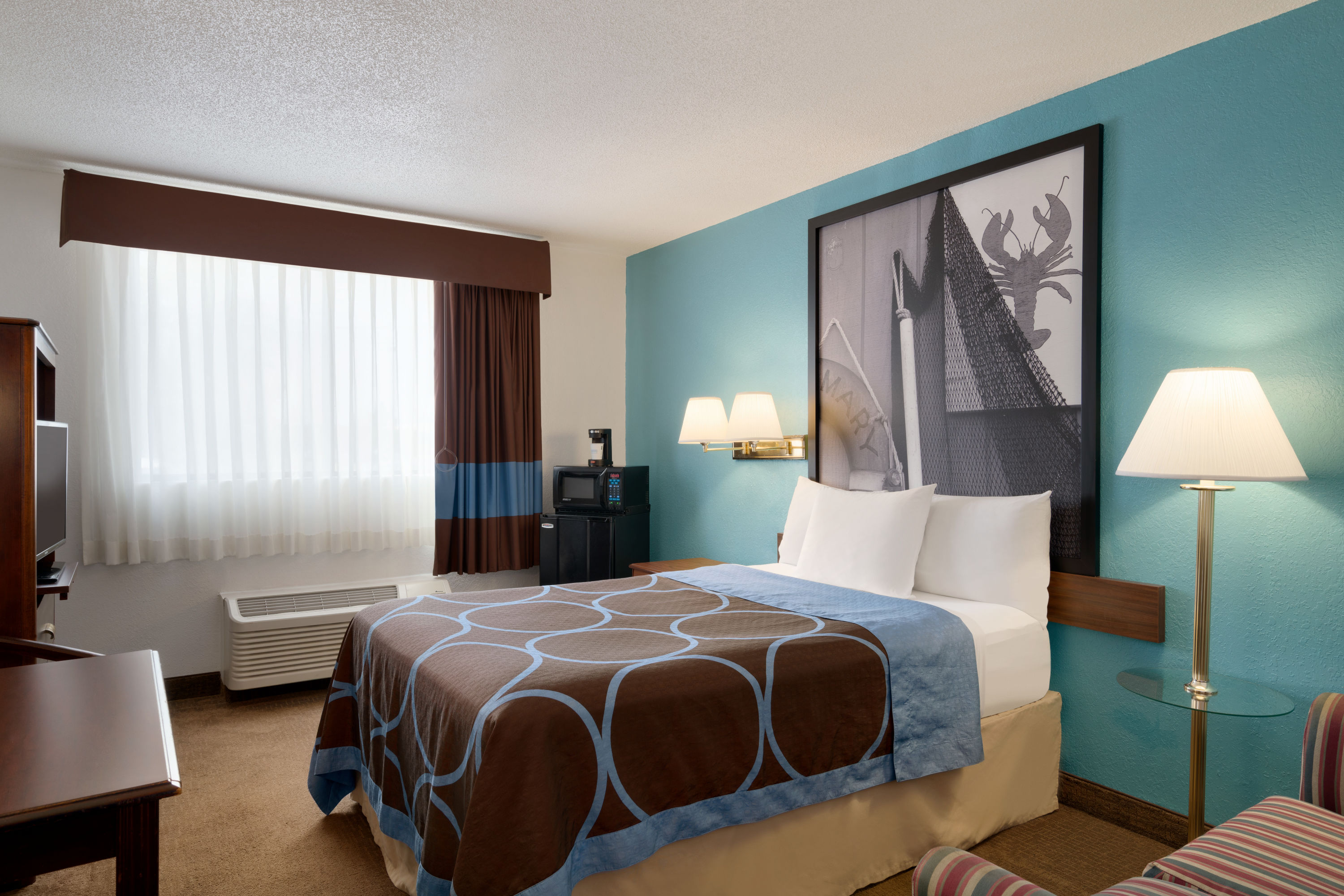 King bed guest room at the Super 8 by Wyndham Portland ME in Westbrook, Maine