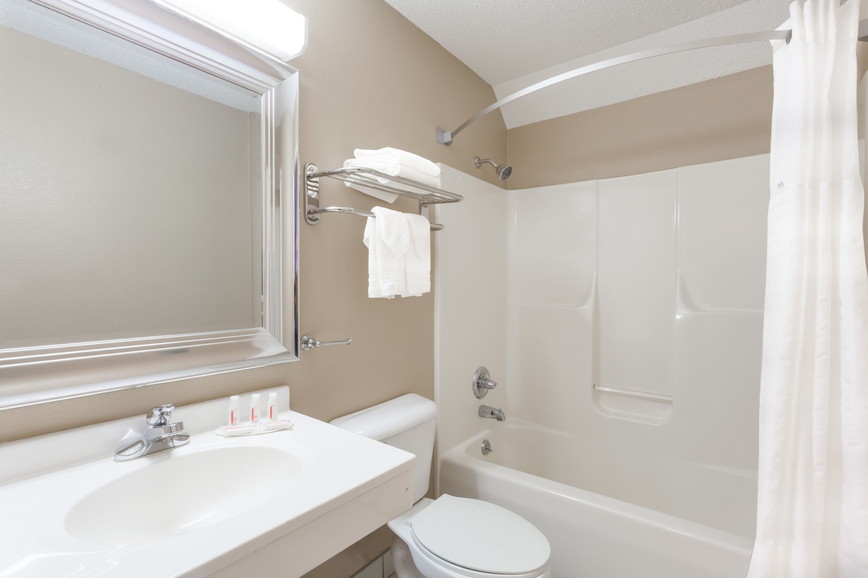 Guest room bath at the Super 8 by Wyndham Adrian in Adrian, Michigan