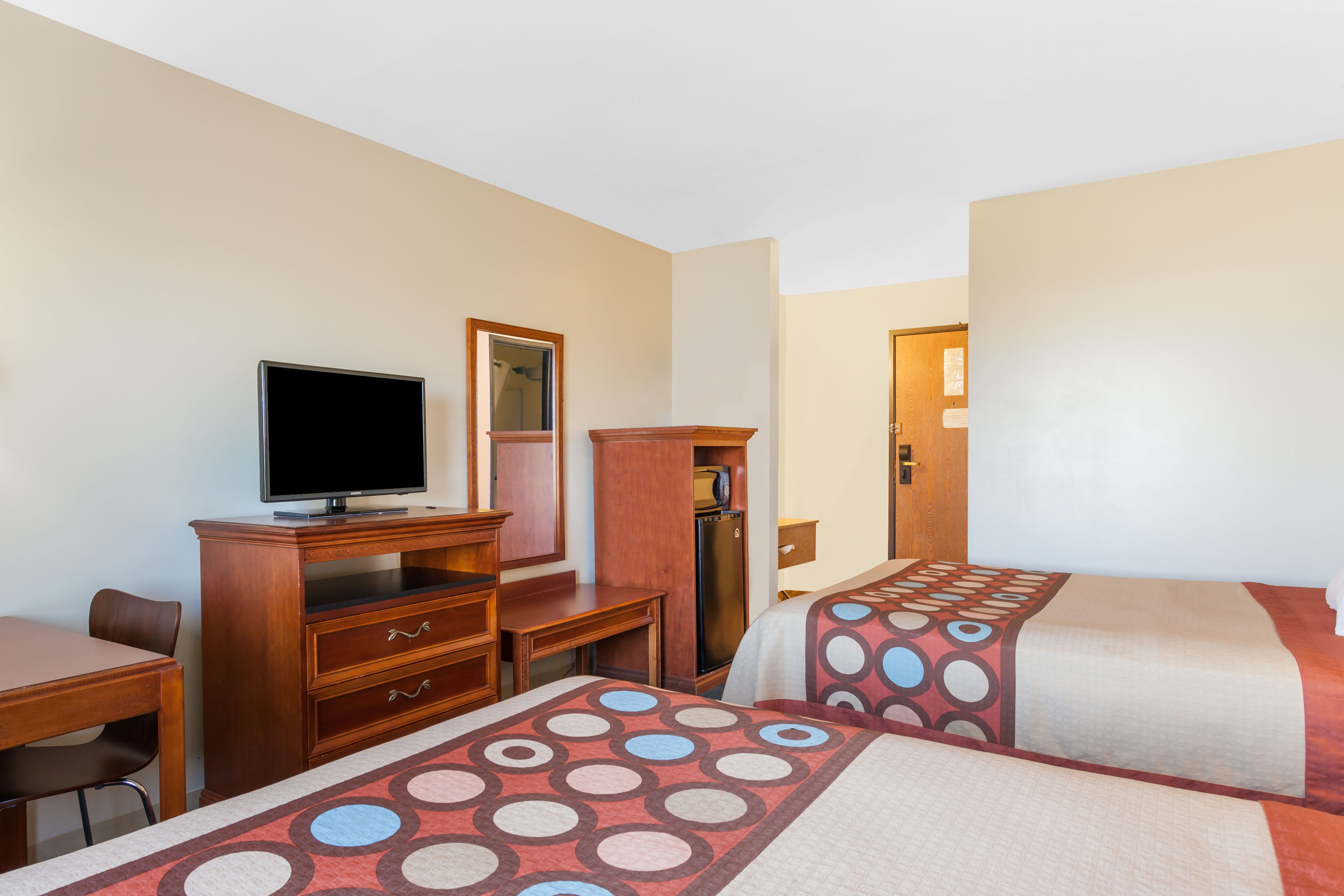 Guest room at the Super 8 by Wyndham Imlay City in Imlay City, Michigan