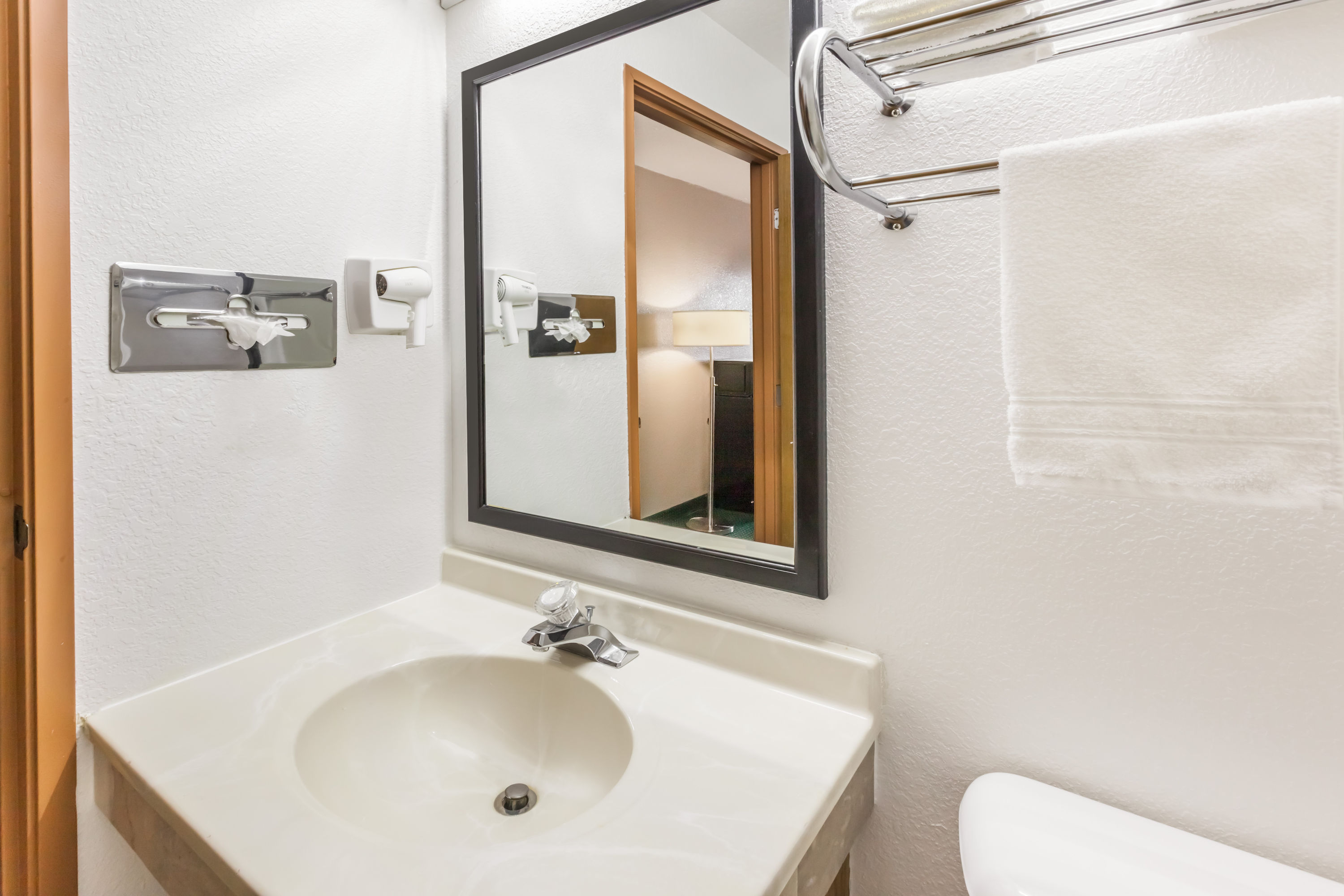 Guest room bath at the Super 8 by Wyndham Ionia MI in Ionia, Michigan