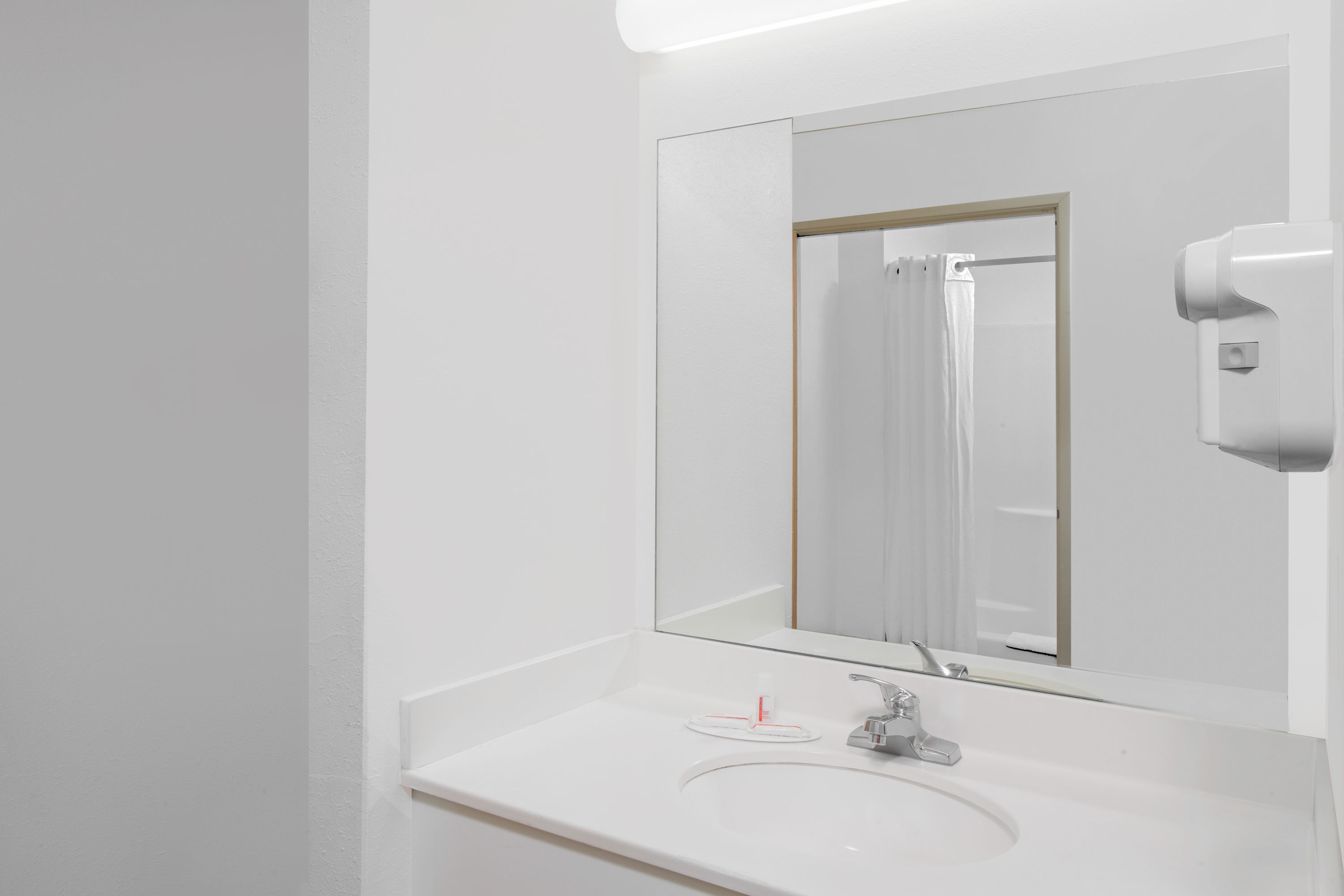 Guest room bath at the Super 8 by Wyndham Three Rivers in Three Rivers, Michigan