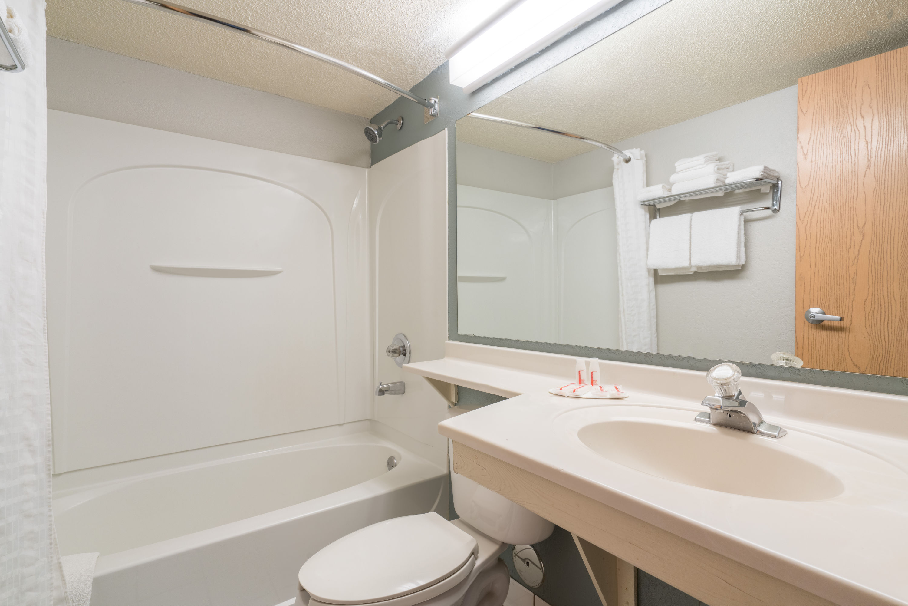 Guest room bath at the Super 8 by Wyndham Bloomington/Airport in Bloomington, Minnesota