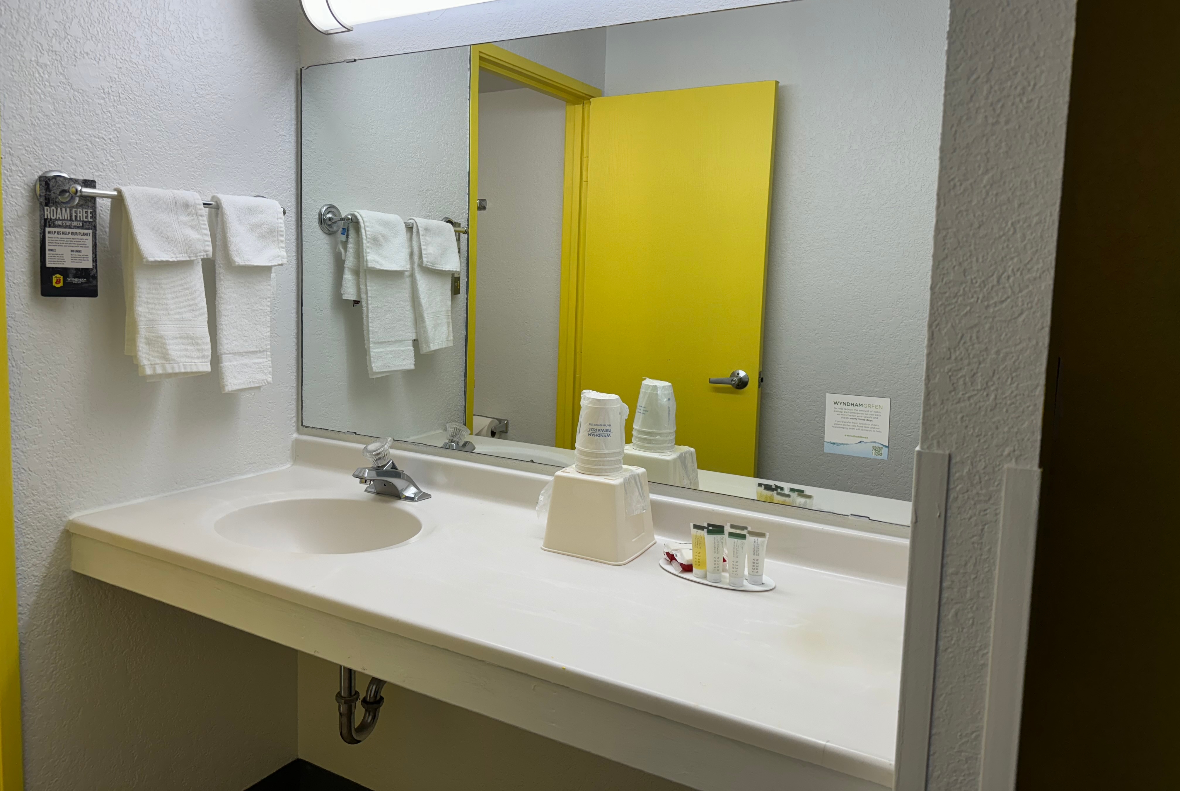 Guest room bath at the Super 8 by Wyndham Bloomington/Airport in Bloomington, Minnesota