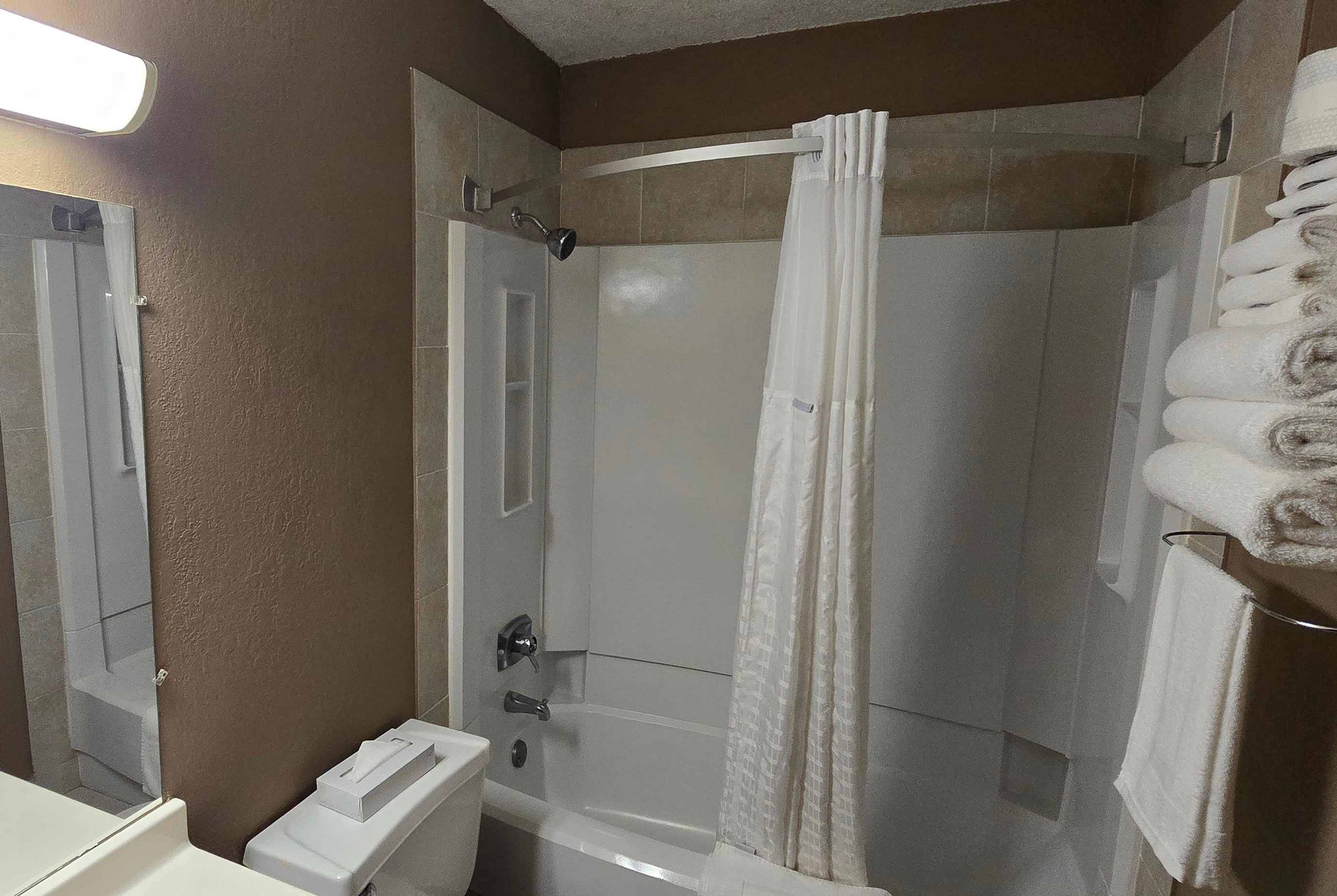 Guest room bath at the Super 8 by Wyndham Rogers Minnesota in Rogers, Minnesota