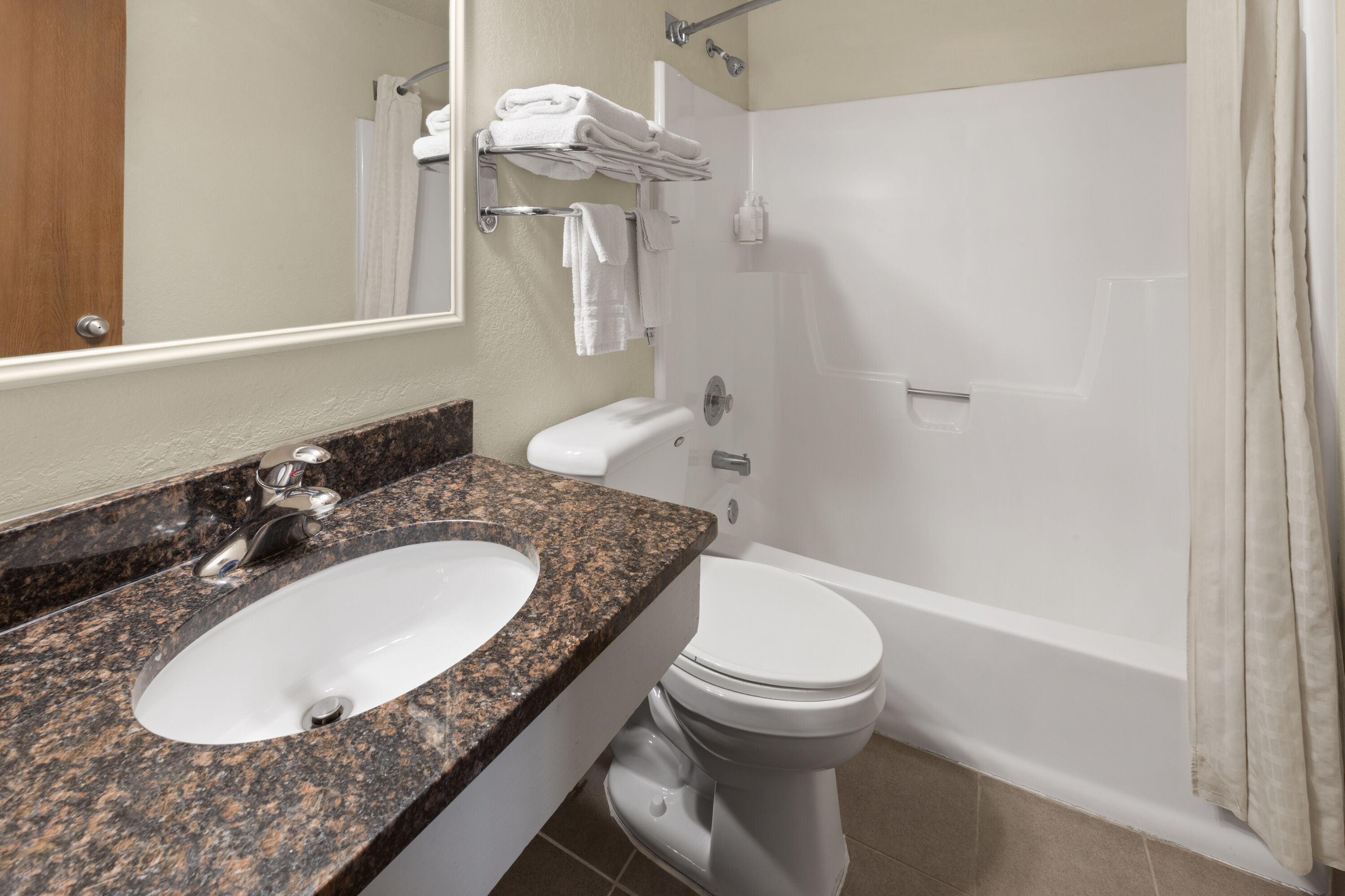 Guest room bath at the Super 8 by Wyndham Winona MN in Winona, Minnesota