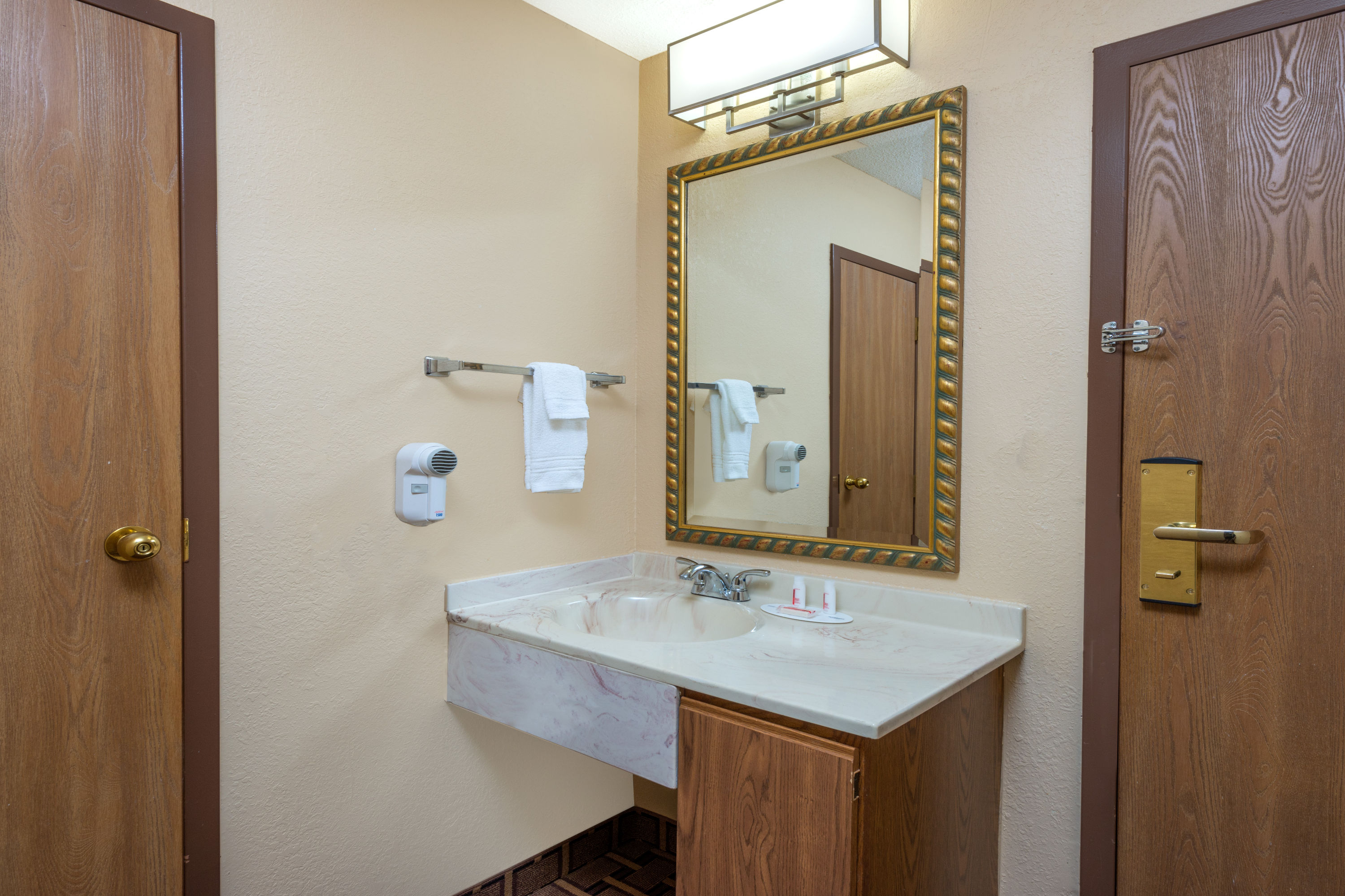 Guest room bath at the Super 8 by Wyndham Charleston/Sikeston East MO in Charleston, Missouri