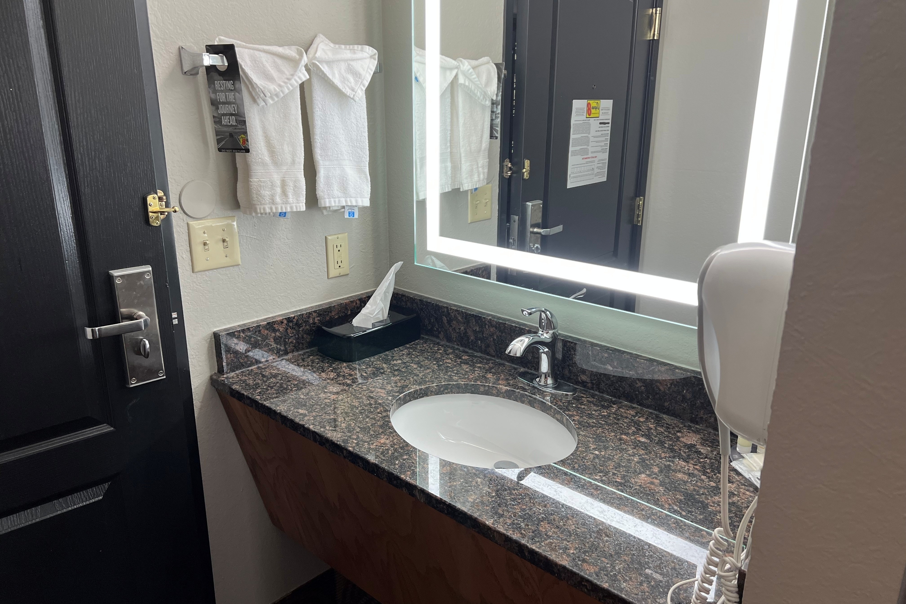 Guest room bath at the Super 8 by Wyndham Lake of the Ozarks in Eldon, Missouri