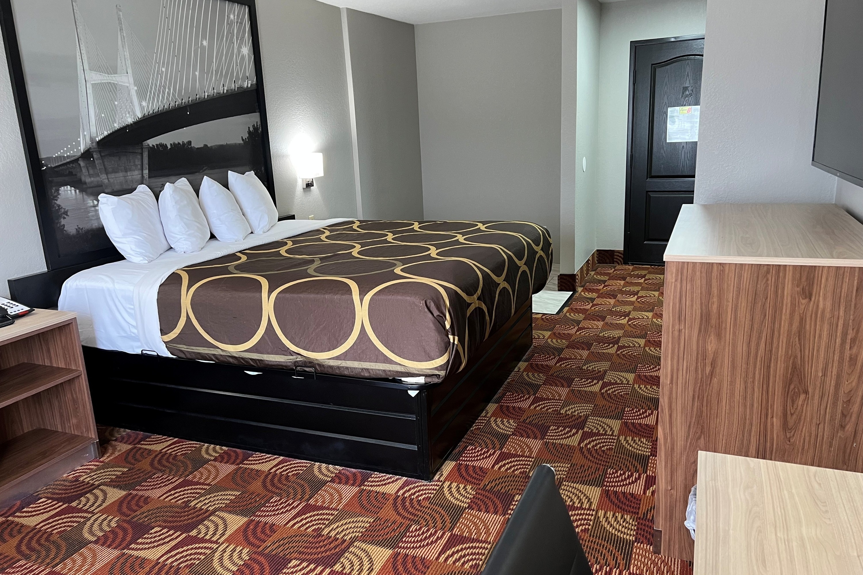 Guest room at the Super 8 by Wyndham Lake of the Ozarks in Eldon, Missouri