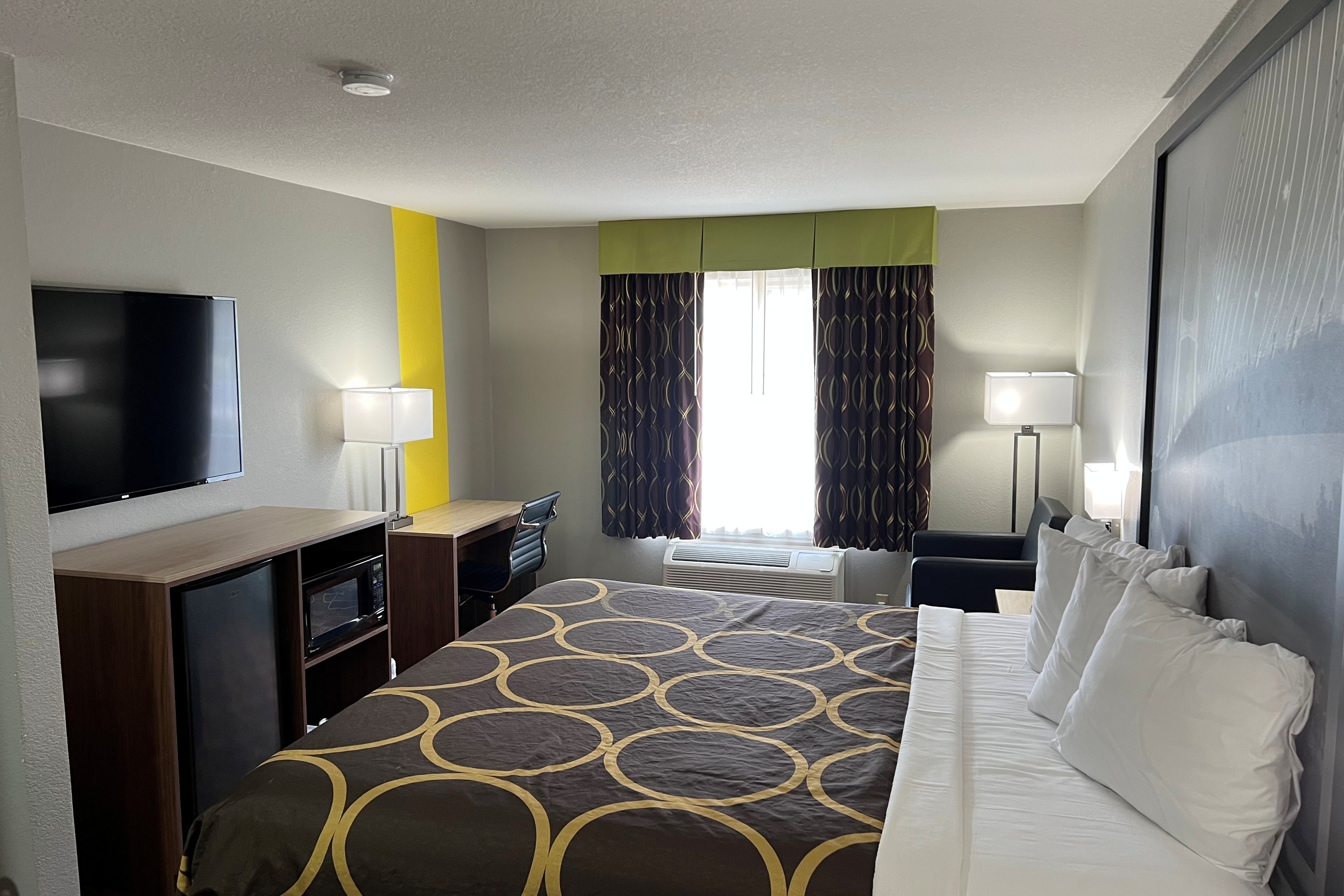 Guest room at the Super 8 by Wyndham Lake of the Ozarks in Eldon, Missouri