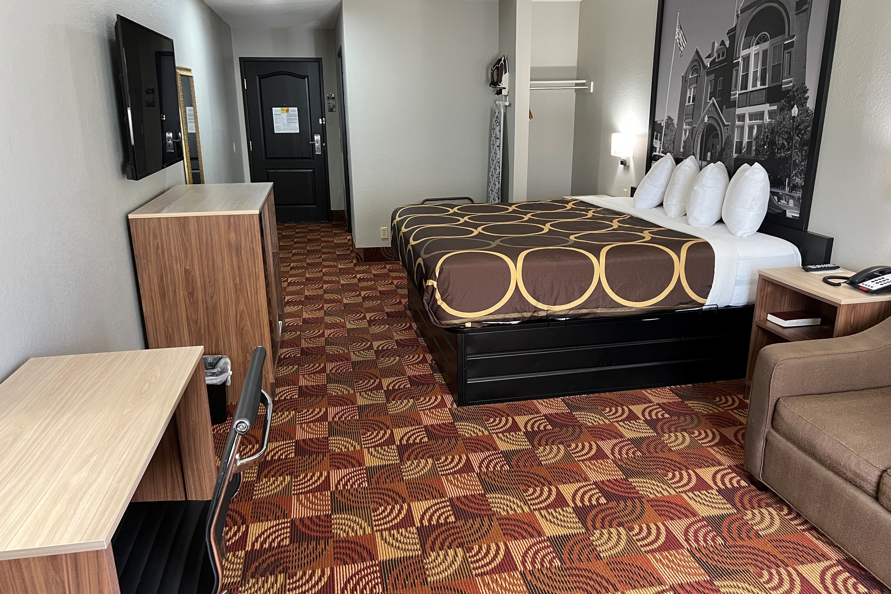 Guest room at the Super 8 by Wyndham Lake of the Ozarks in Eldon, Missouri