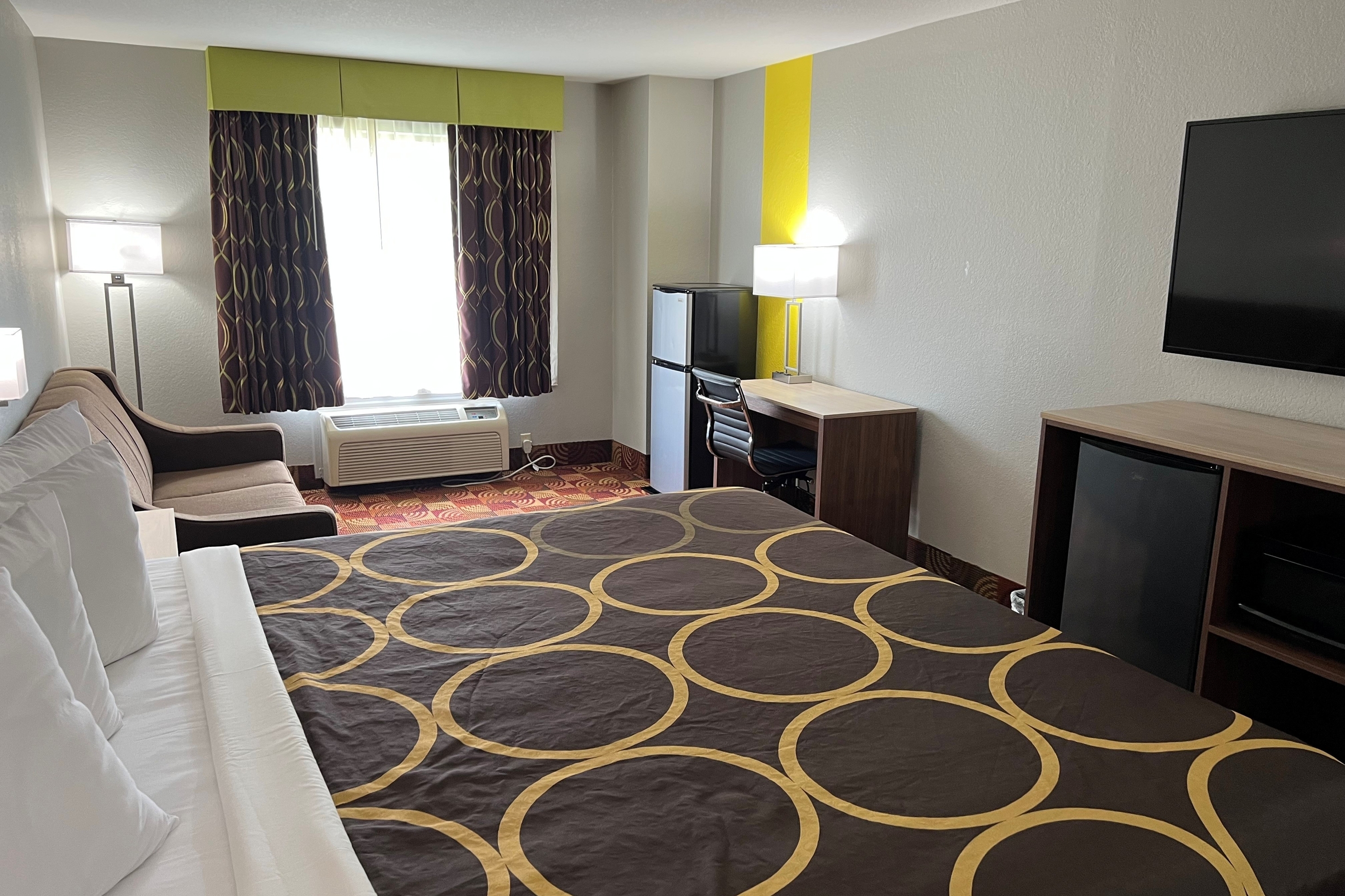 Guest room at the Super 8 by Wyndham Lake of the Ozarks in Eldon, Missouri