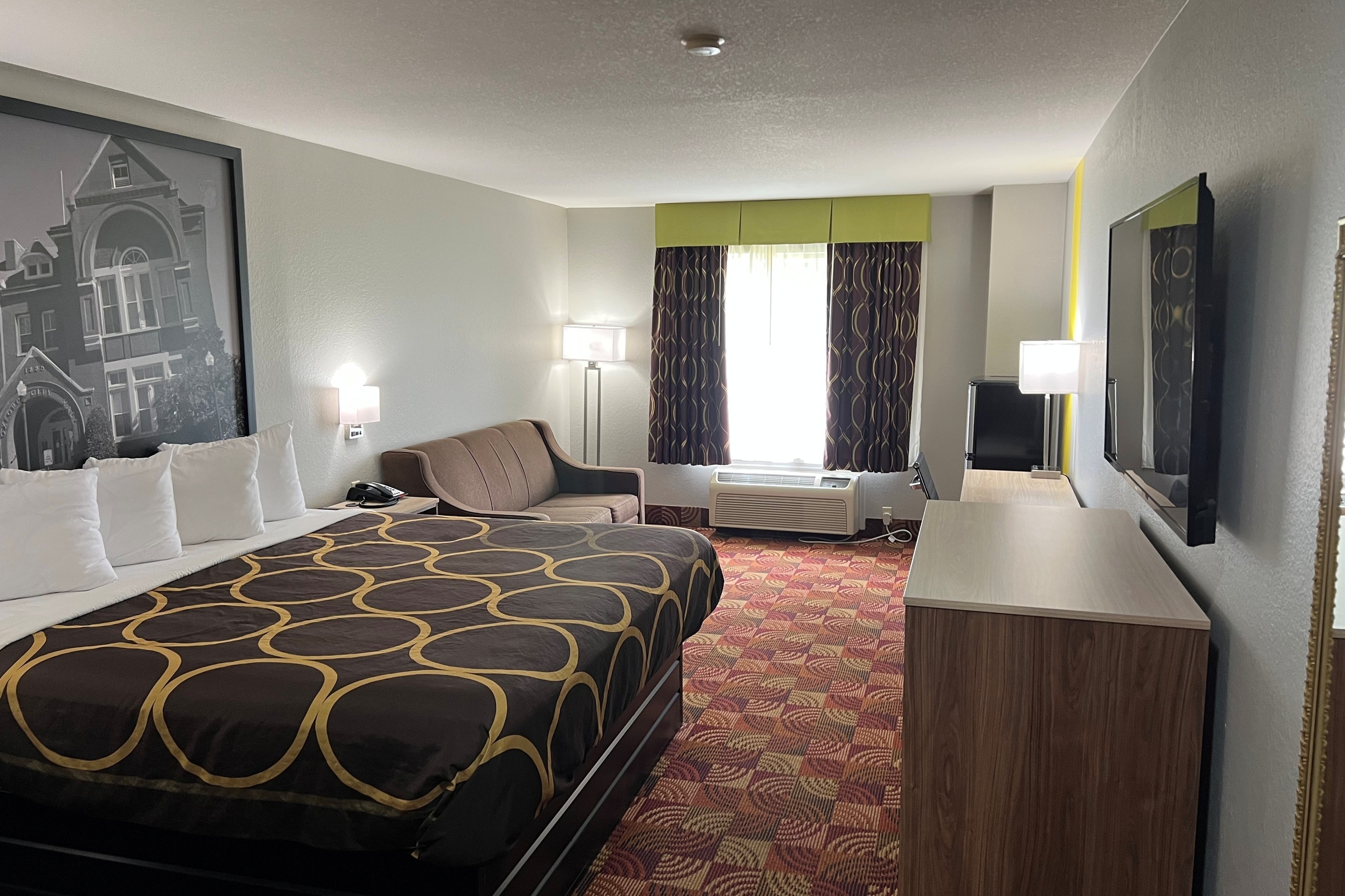 Guest room at the Super 8 by Wyndham Lake of the Ozarks in Eldon, Missouri