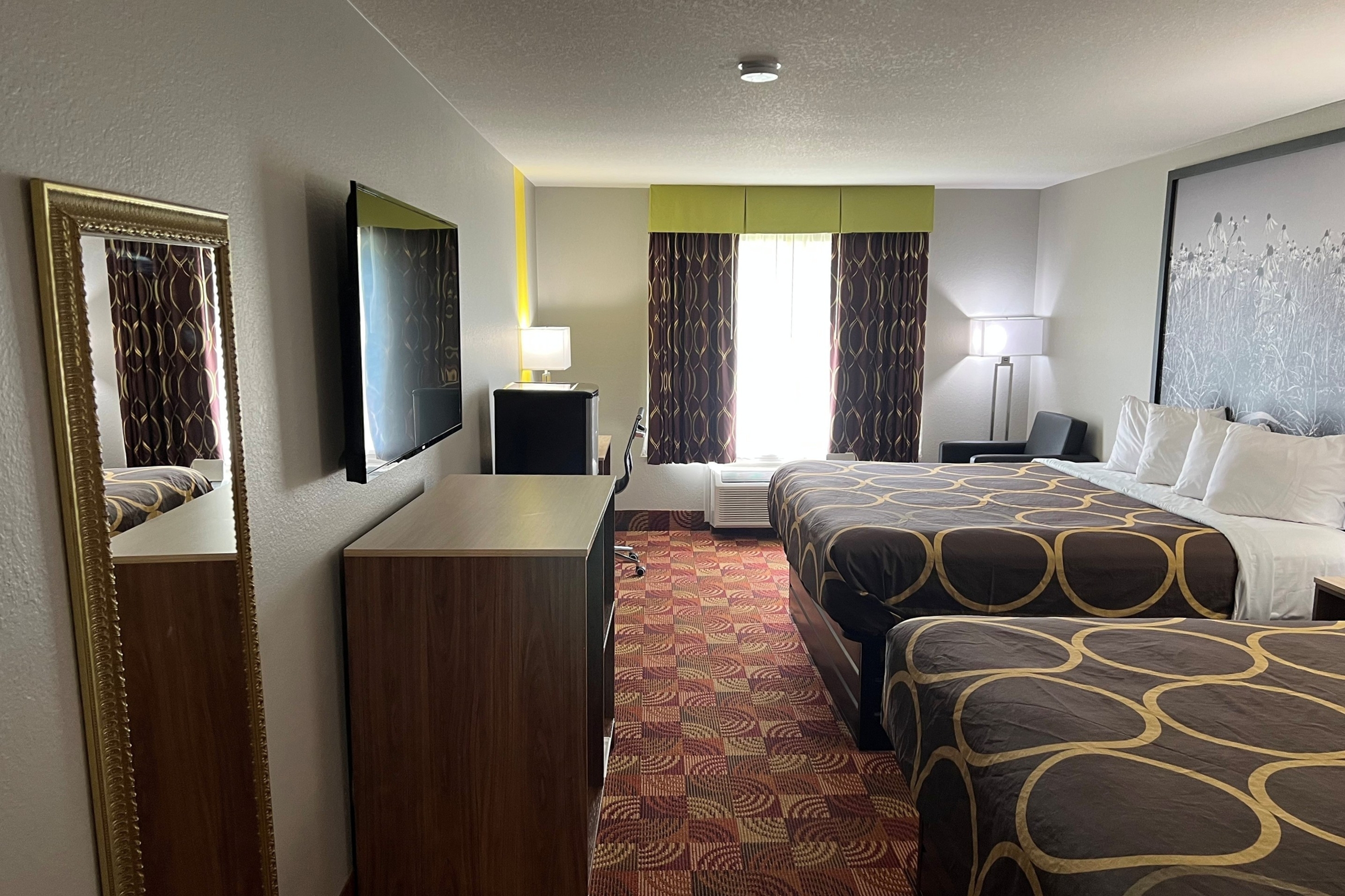 Guest room at the Super 8 by Wyndham Lake of the Ozarks in Eldon, Missouri