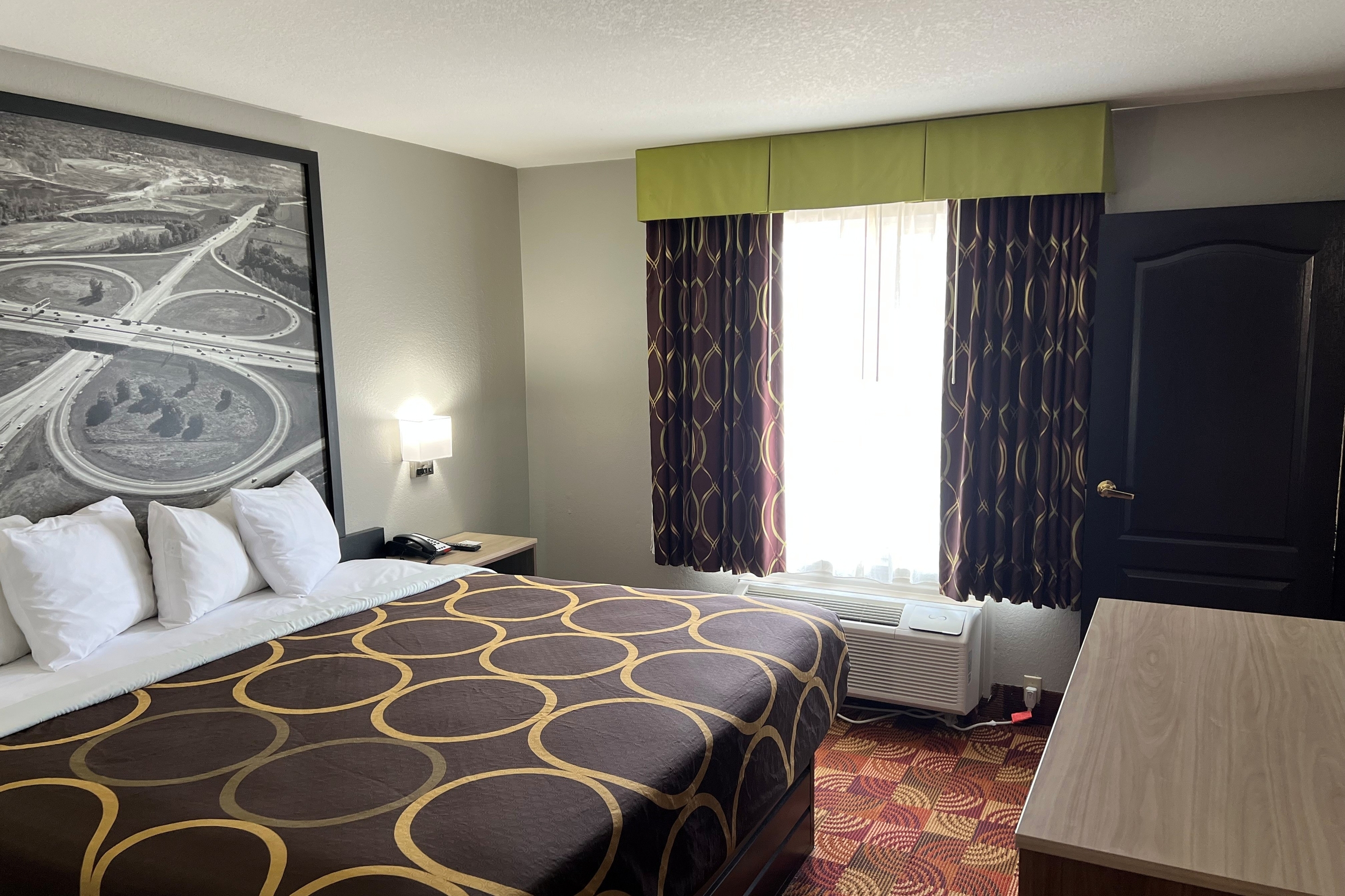 Guest room at the Super 8 by Wyndham Lake of the Ozarks in Eldon, Missouri