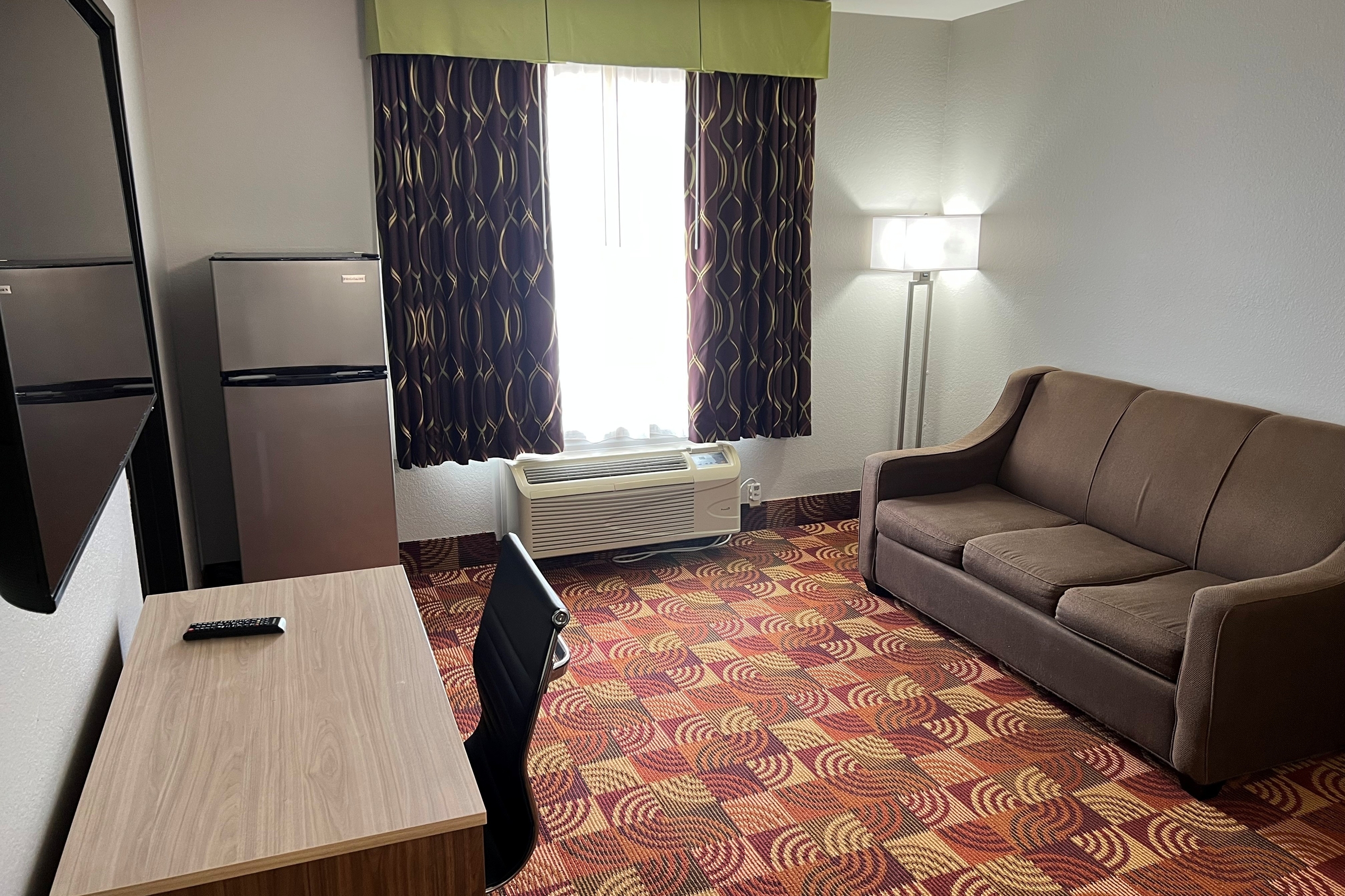 Guest room at the Super 8 by Wyndham Lake of the Ozarks in Eldon, Missouri