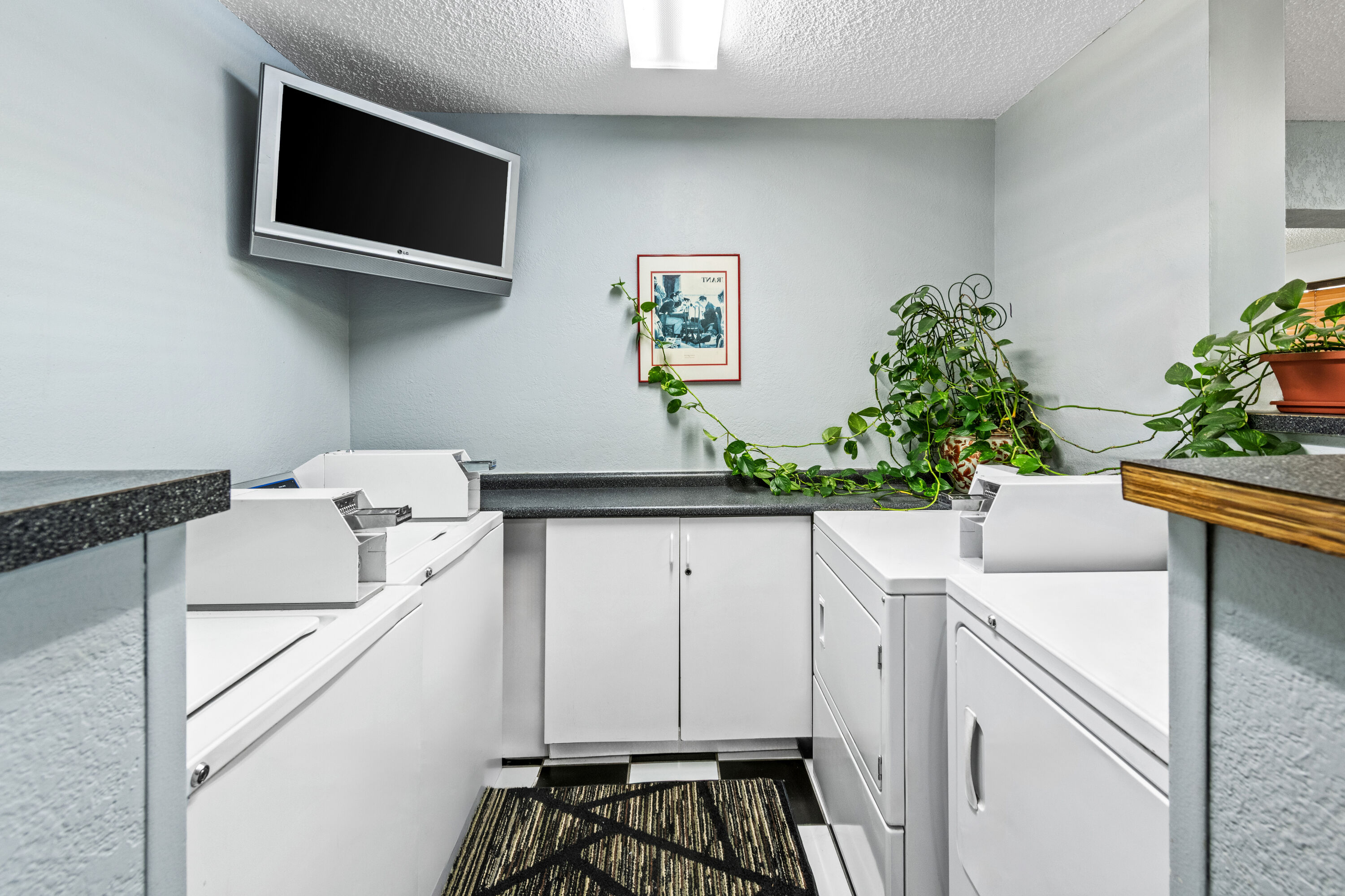 Laundry facilities at Super 8 by Wyndham Independence Kansas City in Independence, Missouri
