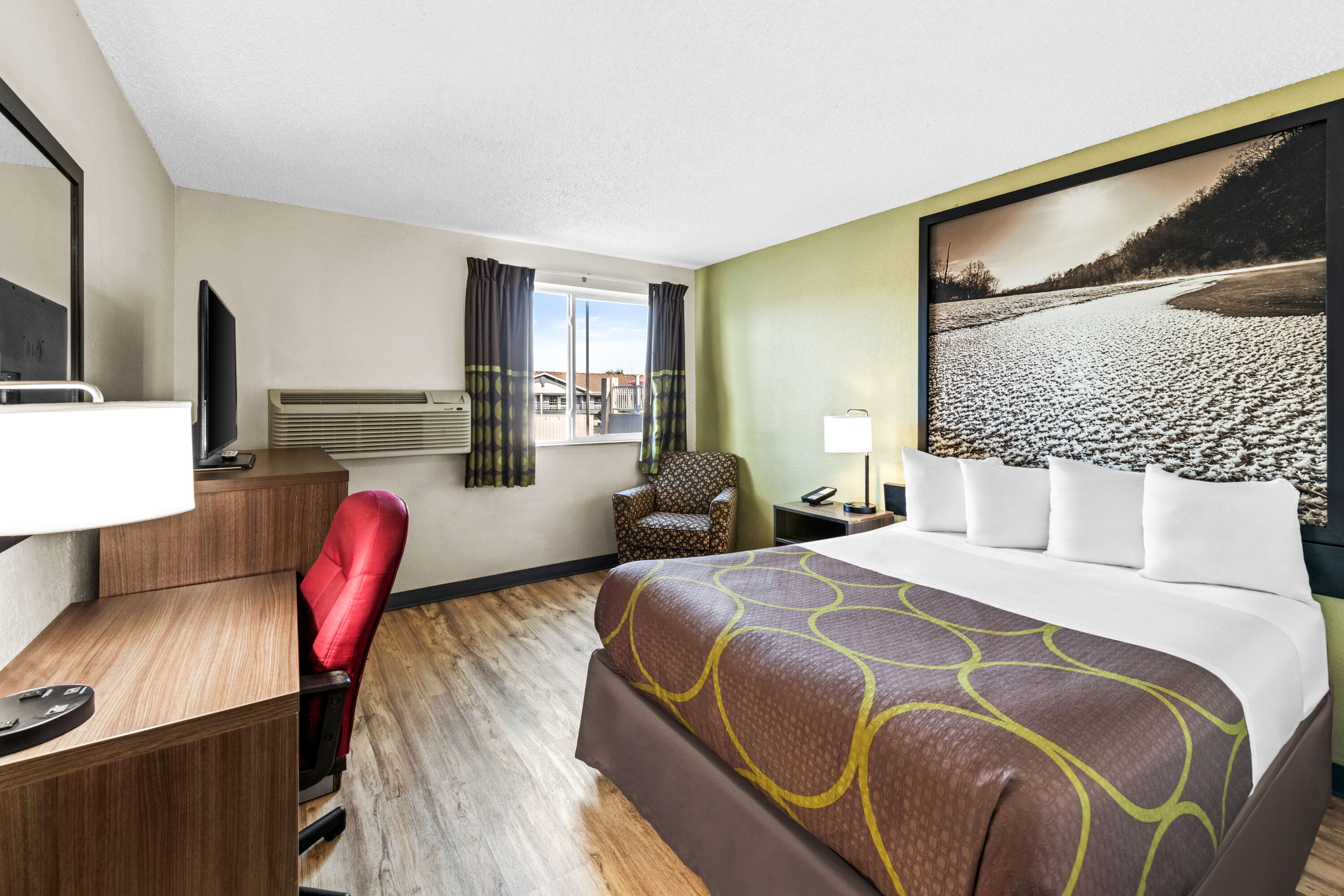 King bed guest room at the Super 8 by Wyndham Independence Kansas City in Independence, Missouri