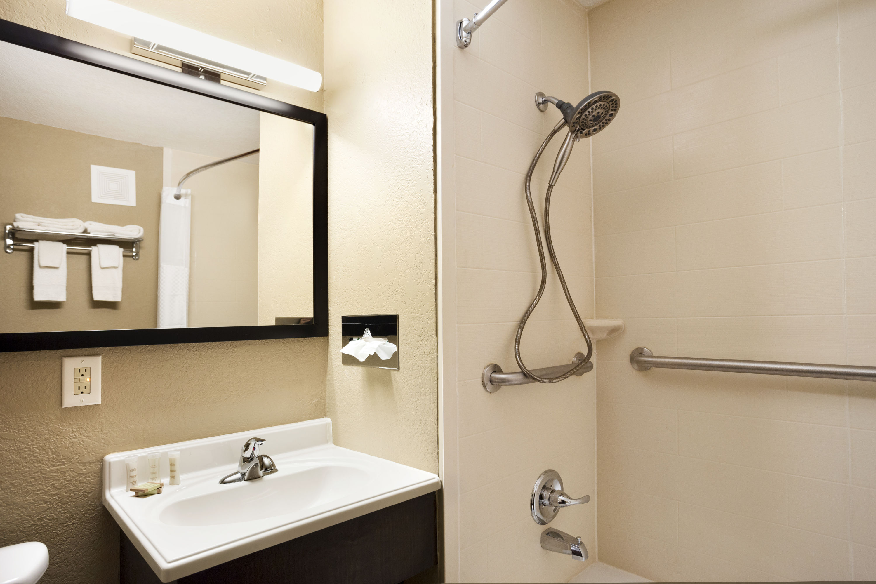 Guest room bath at the Super 8 by Wyndham Joplin in Joplin, Missouri