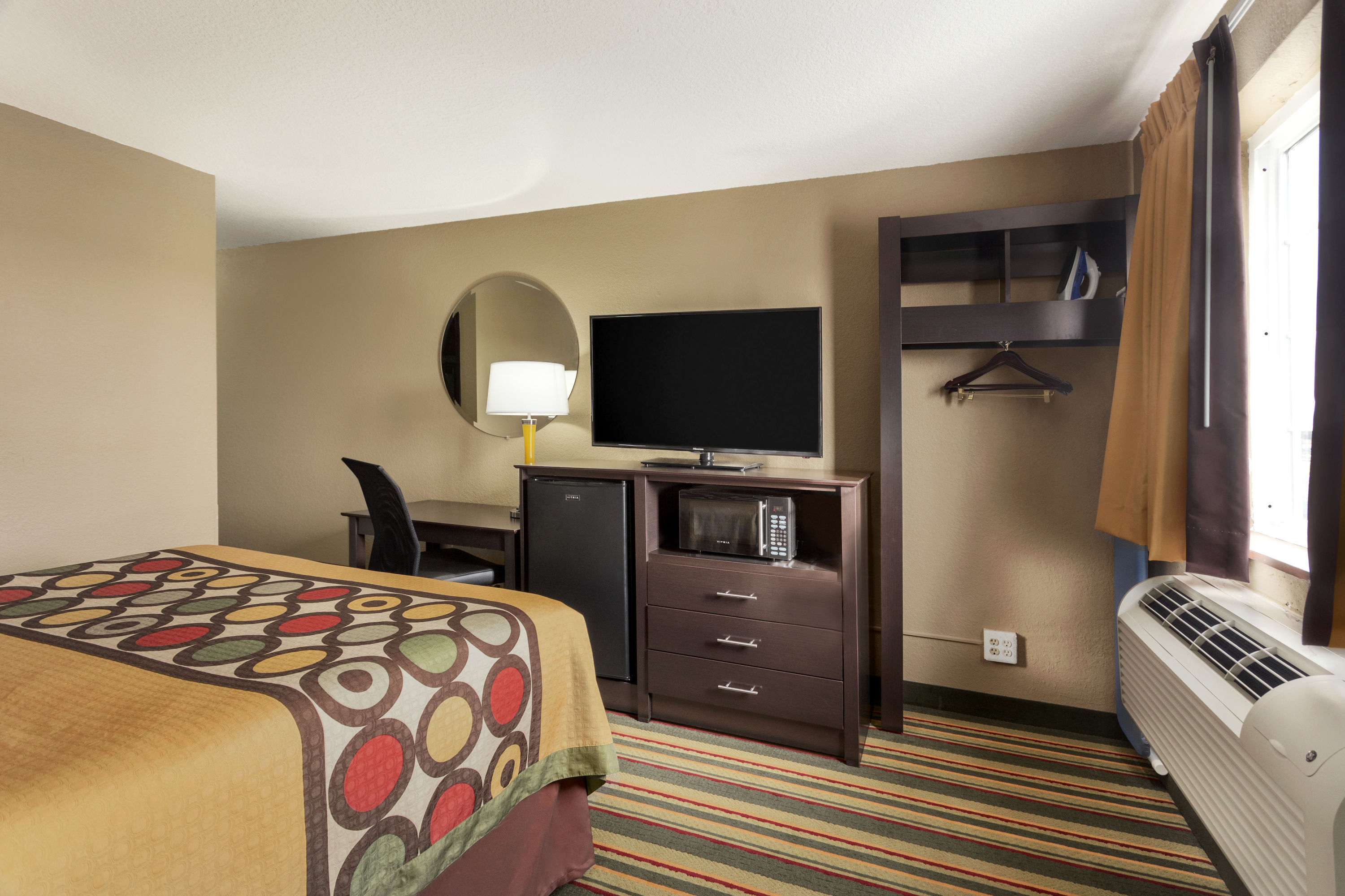 Guest room at the Super 8 by Wyndham Joplin in Joplin, Missouri