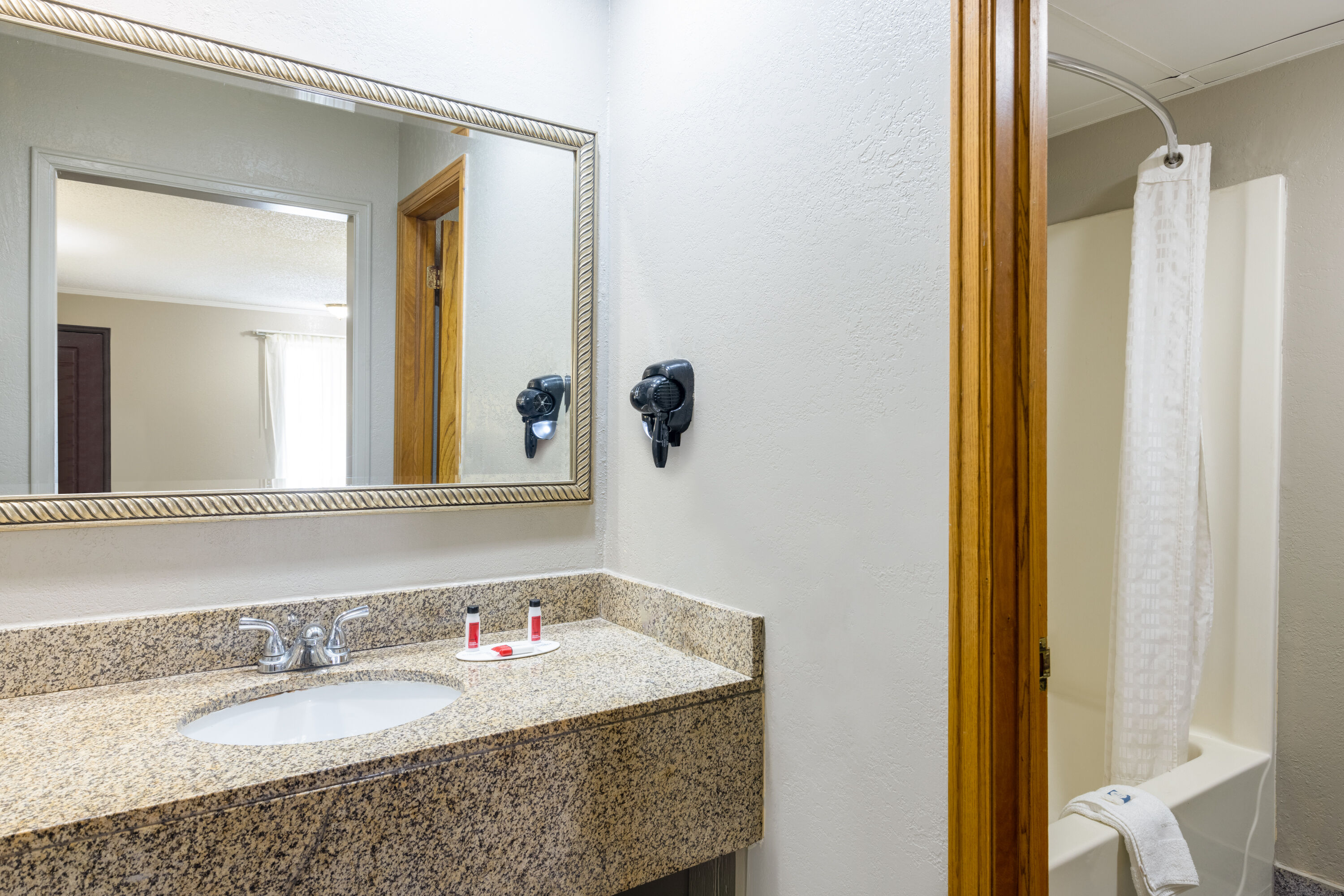 Guest room bath at the Super 8 by Wyndham Kansas City Airport North in Kansas City, Missouri