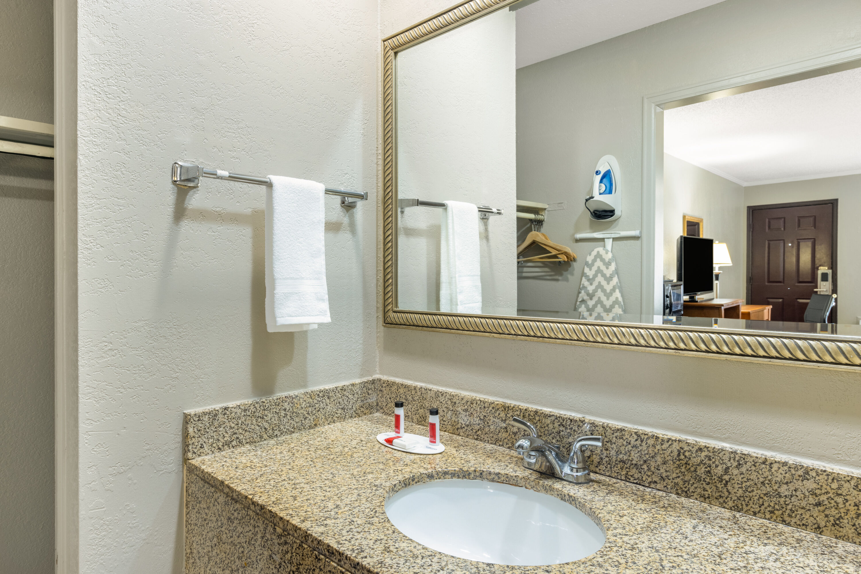 Guest room bath at the Super 8 by Wyndham Kansas City Airport North in Kansas City, Missouri