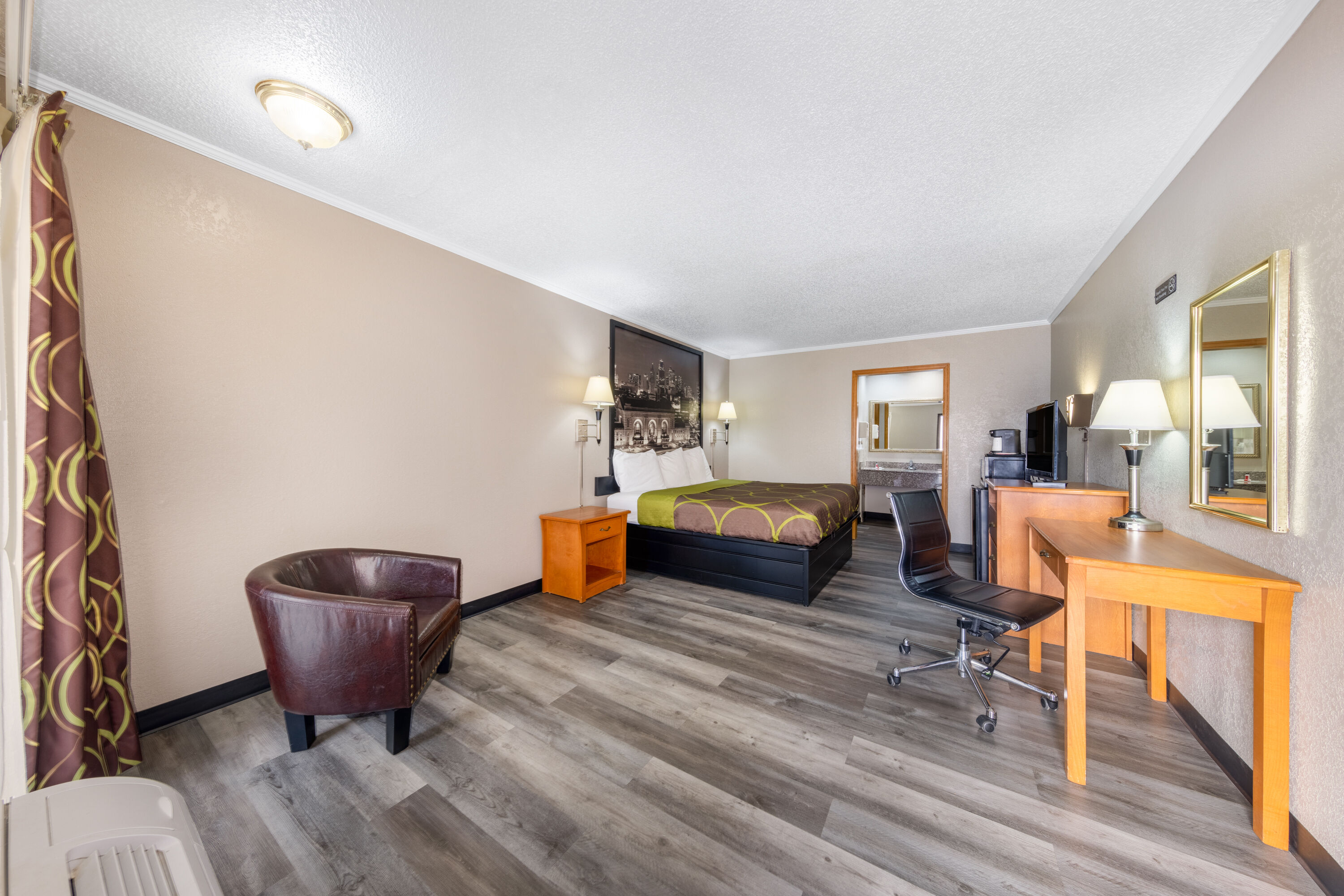 Guest room at the Super 8 by Wyndham Kansas City Airport North in Kansas City, Missouri