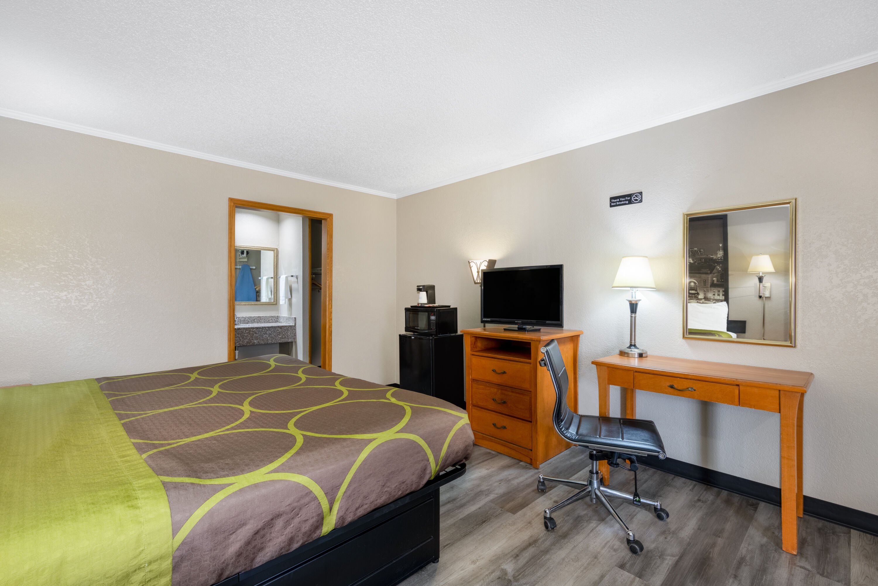 Guest room at the Super 8 by Wyndham Kansas City Airport North in Kansas City, Missouri