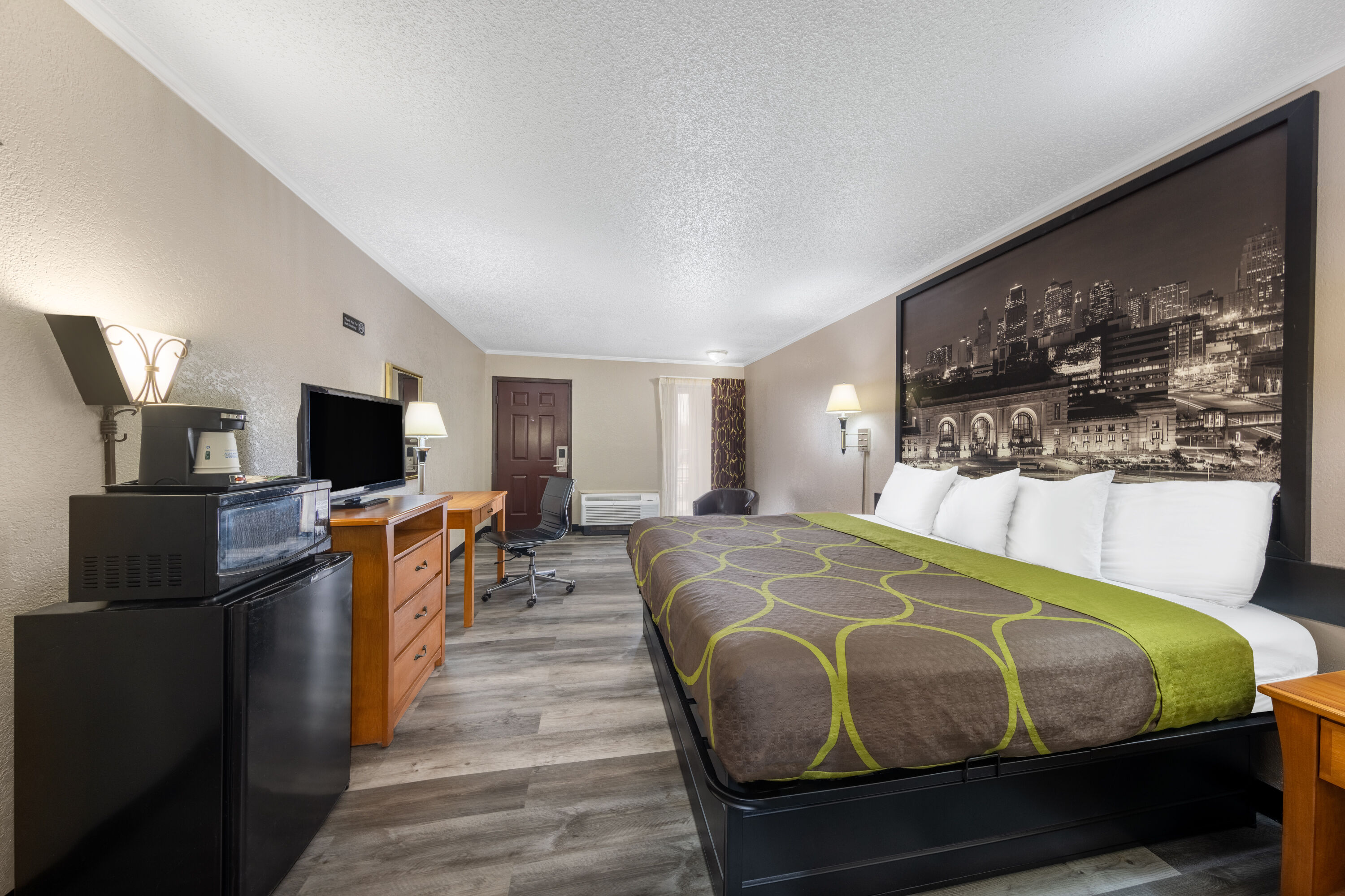 Guest room at the Super 8 by Wyndham Kansas City Airport North in Kansas City, Missouri
