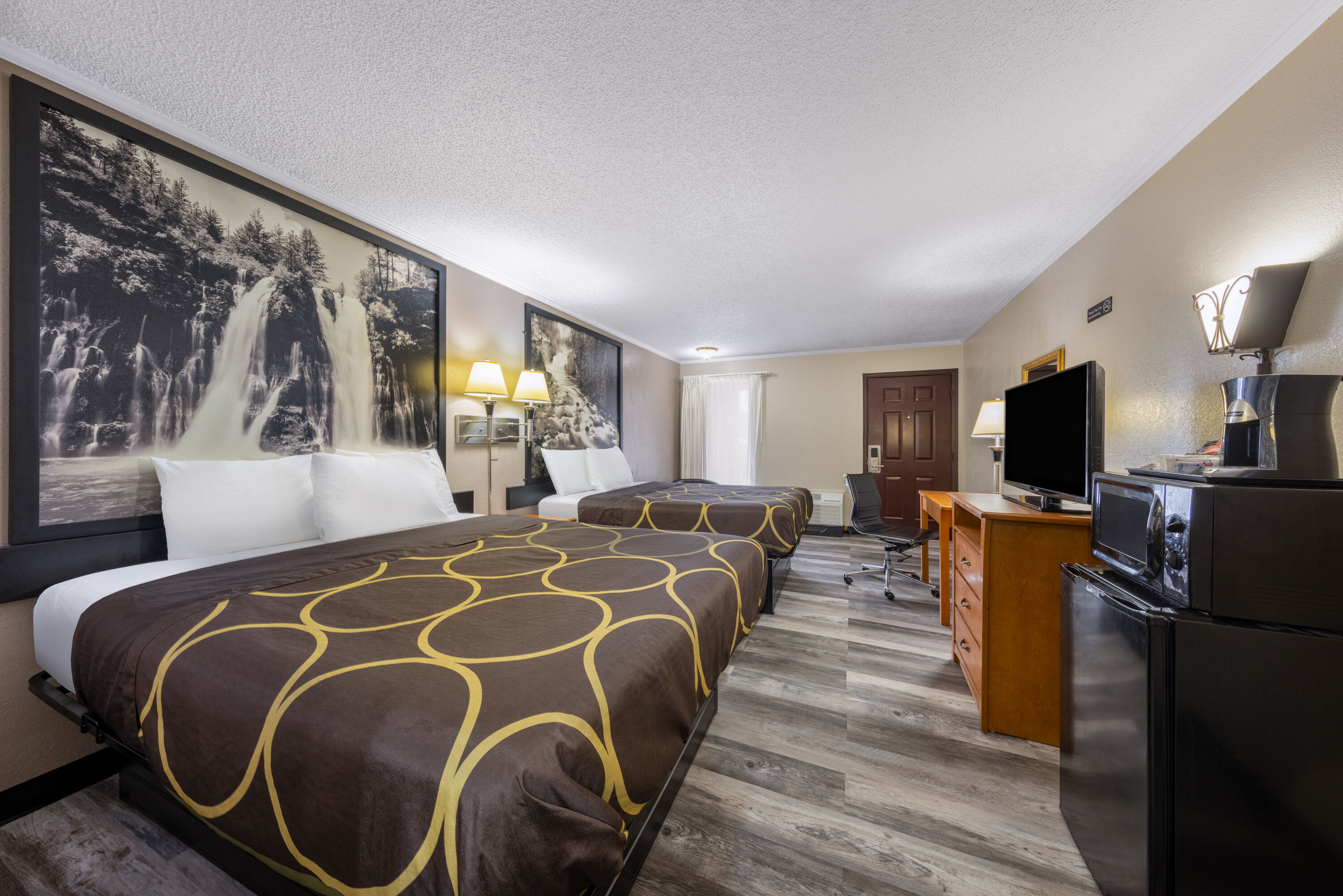 Guest room at the Super 8 by Wyndham Kansas City Airport North in Kansas City, Missouri