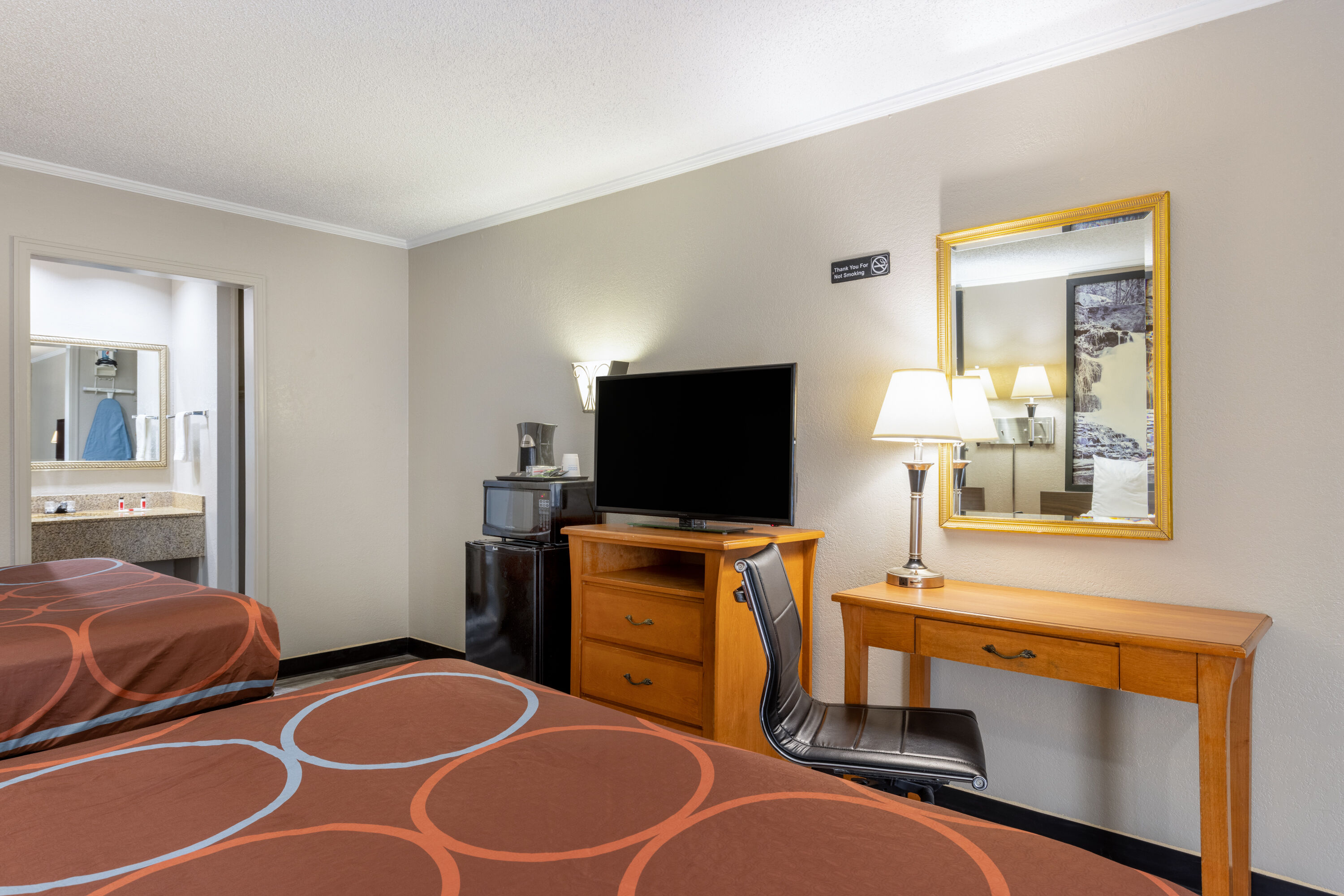 Guest room at the Super 8 by Wyndham Kansas City Airport North in Kansas City, Missouri