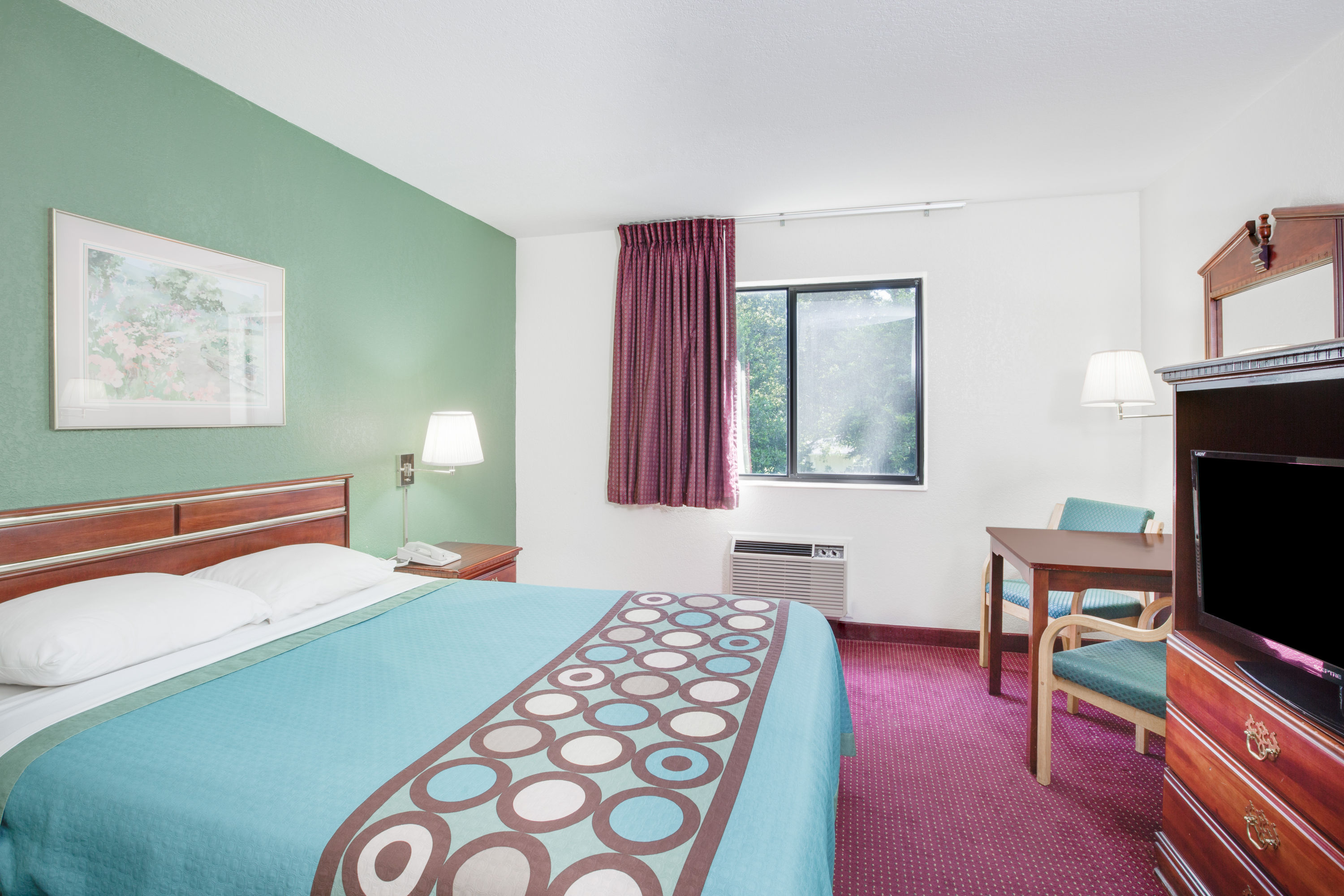 Guest room at the Super 8 by Wyndham Kennett in Kennett, Missouri