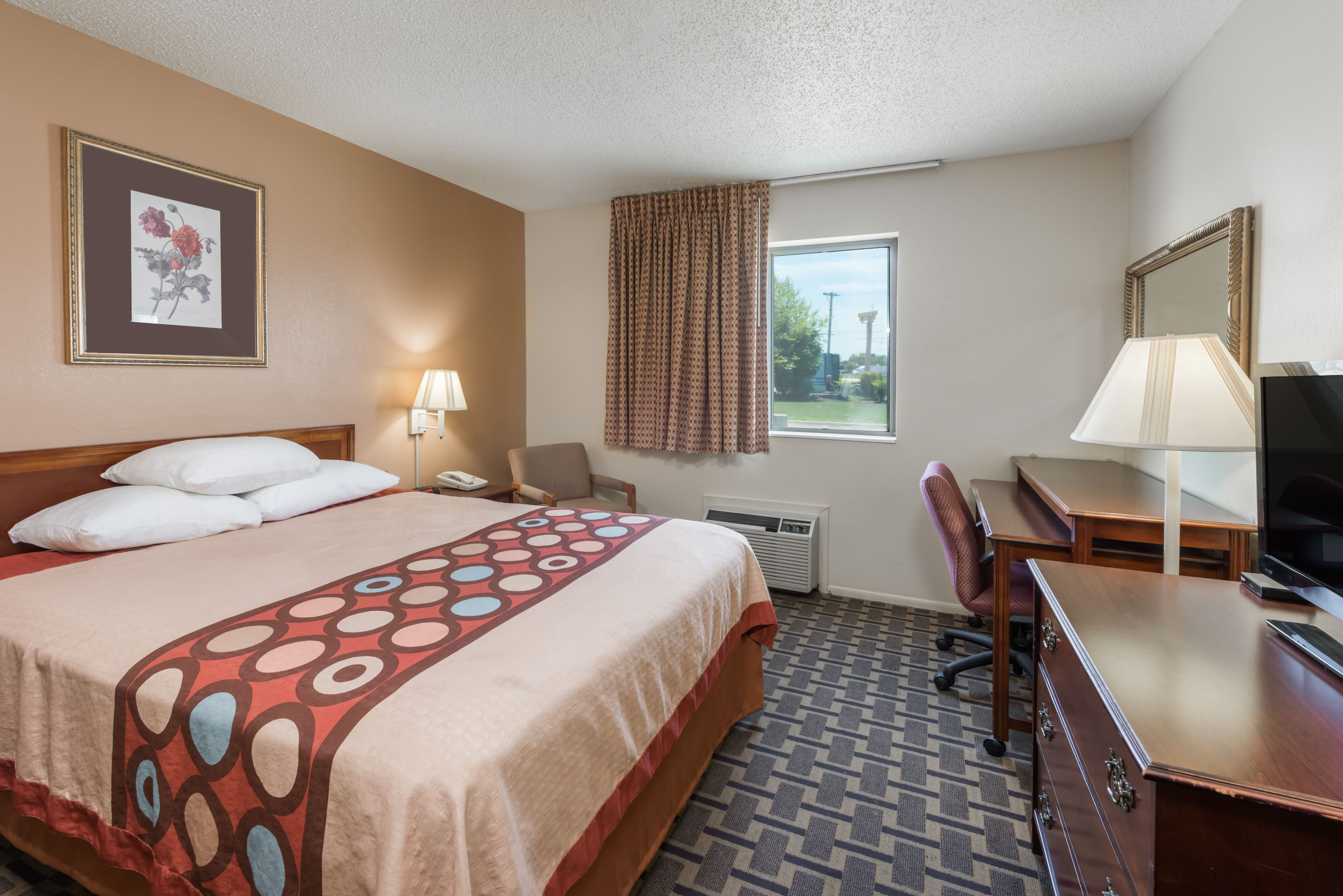 Guest room at the Super 8 by Wyndham Lebanon in Lebanon, Missouri