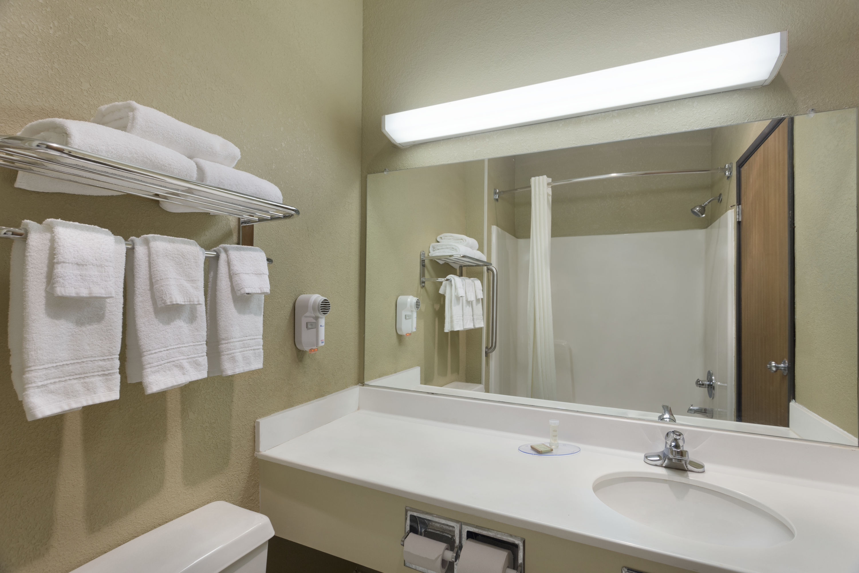 Guest room bath at the Super 8 by Wyndham Lees Summit in Lees Summit, Missouri