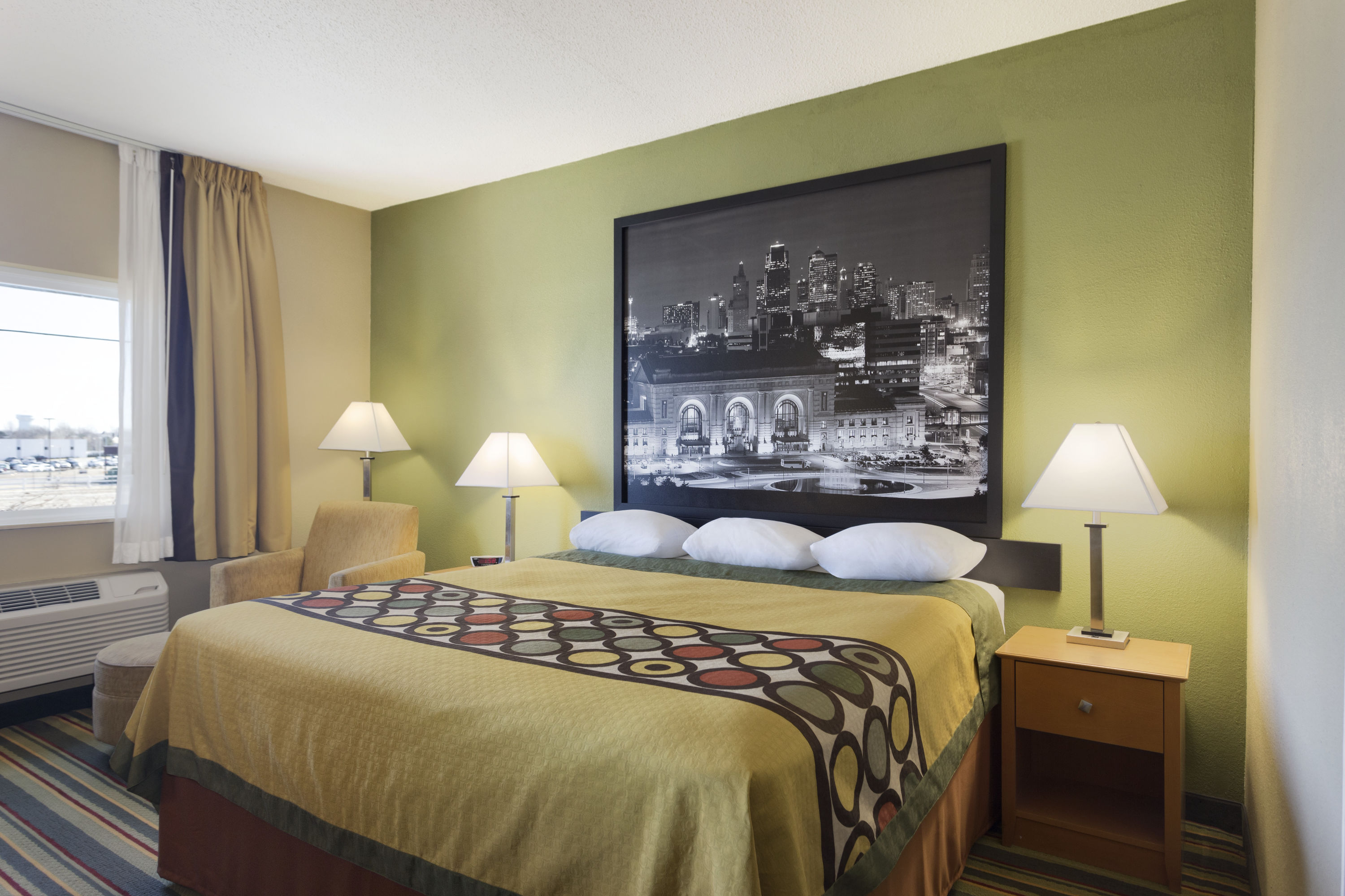 Guest room at the Super 8 by Wyndham Lees Summit in Lees Summit, Missouri